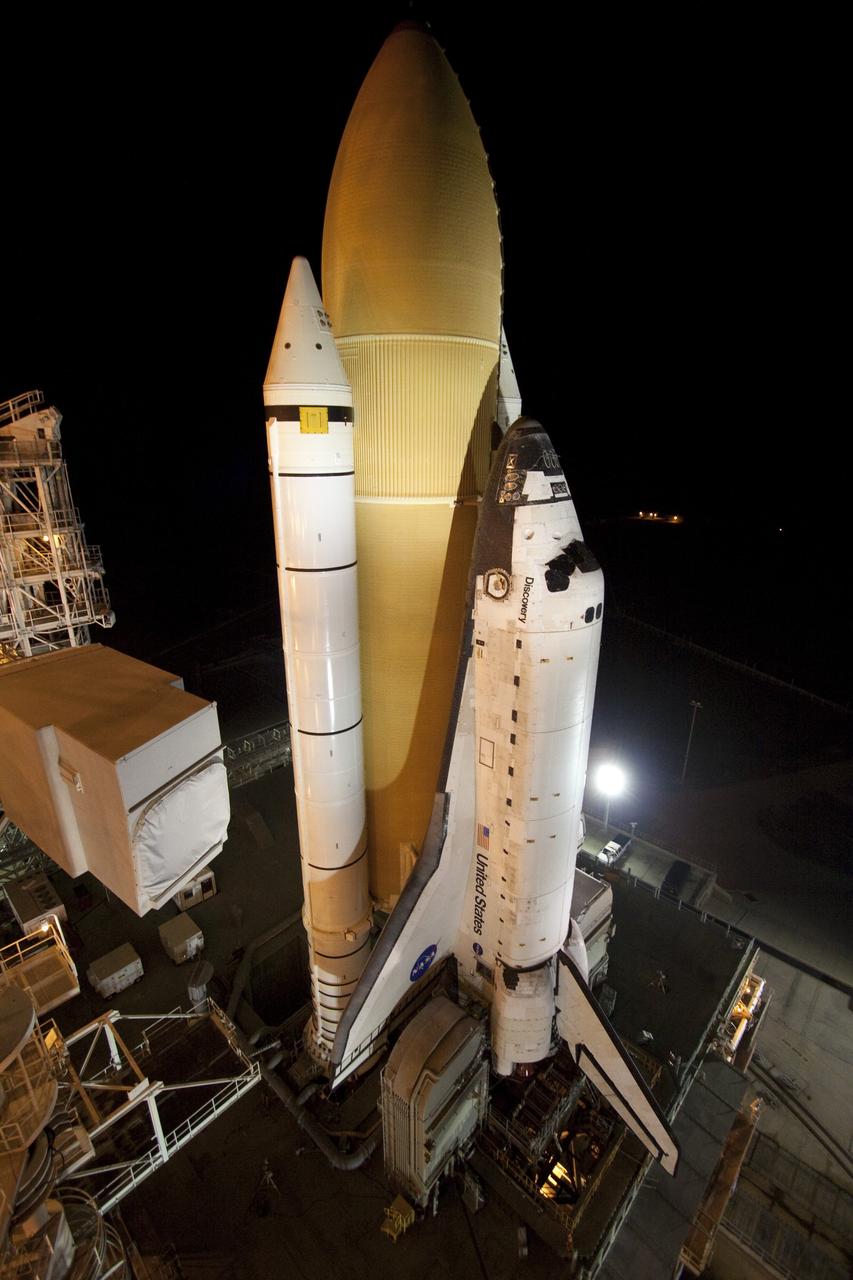 CAPE CANAVERAL, Fla. -- At NASA's Kennedy Space Center in Florida, space shuttle Discovery is attached to Launch Pad 39A, completing "rollout" from the Vehicle Assembly Building to Launch Pad 39A. It took the shuttle, attached to its external fuel tank, twin solid rocket boosters and mobile launcher platform, about six hours to complete the move atop a crawler-transporter. Rollout sets the stage for Discovery's STS-133 crew to practice countdown and launch procedures during the Terminal Countdown Demonstration Test in mid-October. Targeted to liftoff Nov. 1, Discovery will take the Permanent Multipurpose Module (PMM) packed with supplies and critical spare parts, as well as Robonaut 2 (R2) to the International Space Station. Photo credit: NASA/Jack Pfaller