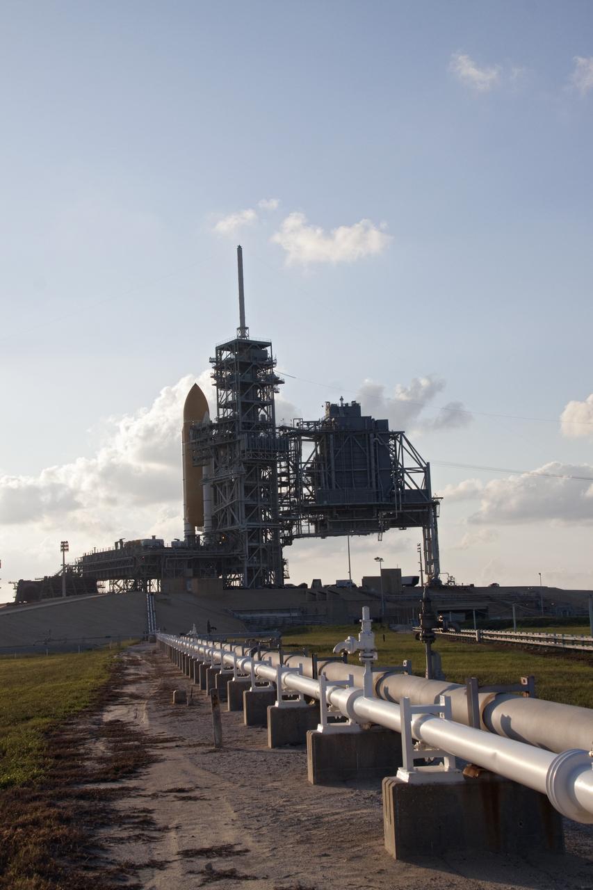 CAPE CANAVERAL, Fla. -- Space shuttle Discovery is visible on Launch Pad 39A at NASA's Kennedy Space Center in Florida before the rotating service structure, which protects it from the elements, is moved into place. It took the spacecraft about six hours to make the journey, known as "rollout," from the Vehicle Assembly Building to the pad. Rollout sets the stage for Discovery's STS-133 crew to practice countdown and launch procedures during the Terminal Countdown Demonstration Test in mid-October. Targeted to liftoff Nov. 1, Discovery will take the Permanent Multipurpose Module (PMM) packed with supplies and critical spare parts, as well as Robonaut 2 (R2) to the International Space Station. Photo credit: NASA/Jack Pfaller