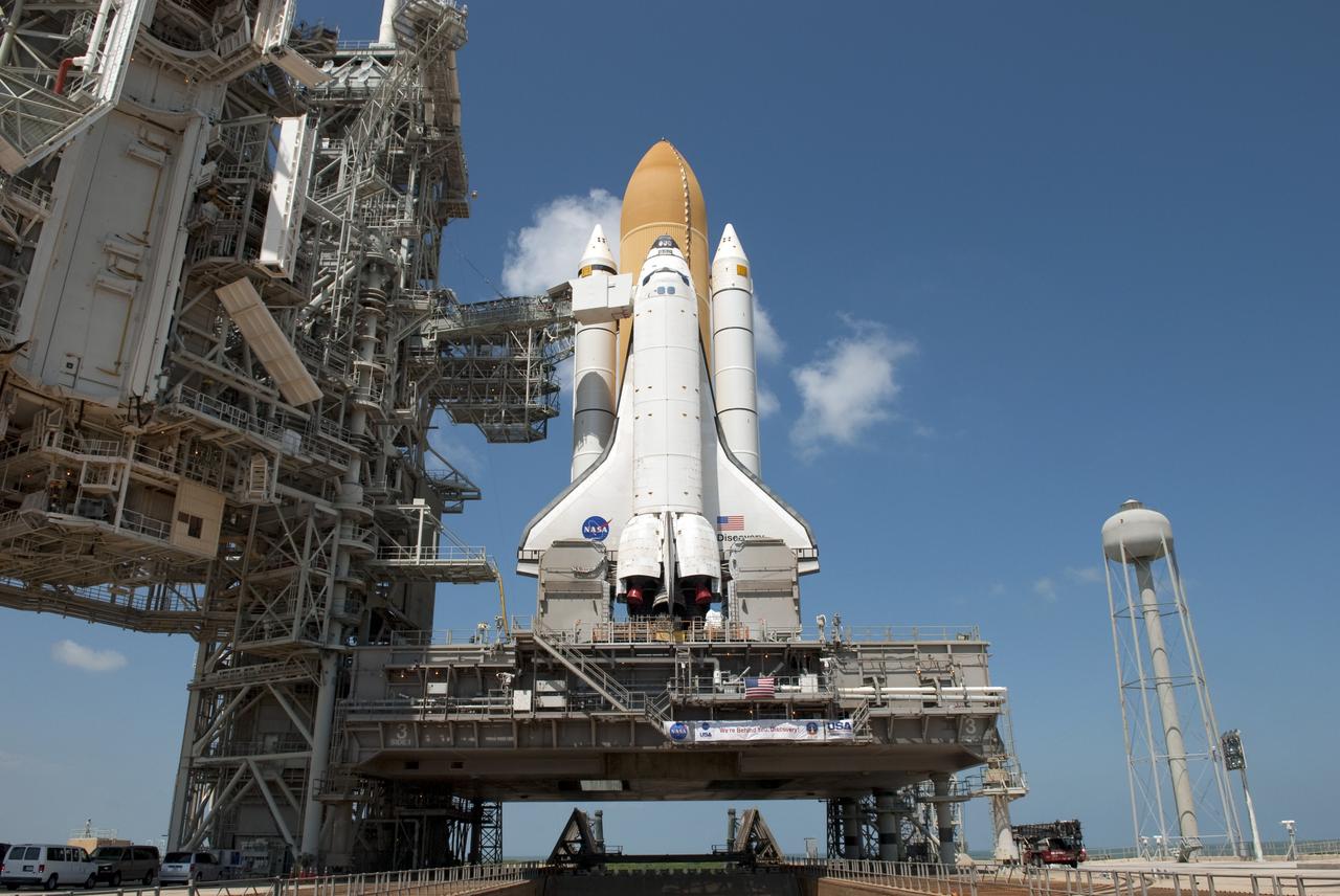 CAPE CANAVERAL, Fla. -- At NASA's Kennedy Space Center in Florida, space shuttle Discovery is visible on Launch Pad 39A before the rotating service structure, which protects it from the elements and provides access to the shuttle, is moved into place. It took the spacecraft about six hours to make the journey, known as "rollout," from the Vehicle Assembly Building to the pad. Rollout sets the stage for Discovery's STS-133 crew to practice countdown and launch procedures during the Terminal Countdown Demonstration Test in mid-October. Targeted to liftoff Nov. 1, Discovery will take the Permanent Multipurpose Module (PMM) packed with supplies and critical spare parts, as well as Robonaut 2 (R2) to the International Space Station. Photo credit: NASA/Jim Grossmann