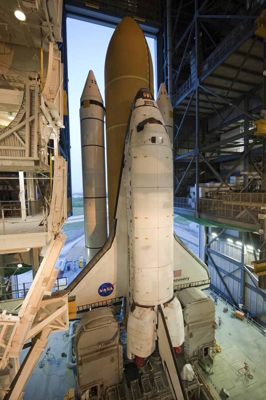 CAPE CANAVERAL, Fla. -- At NASA's Kennedy Space Center in Florida, space shuttle Discovery begins its nighttime trek, known as "rollout," from the Vehicle Assembly Building to Launch Pad 39A. It will take the shuttle, attached to its external fuel tank, twin solid rocket boosters and mobile launcher platform, about six hours to complete the move atop a crawler-transporter. Rollout sets the stage for Discovery's STS-133 crew to practice countdown and launch procedures during the Terminal Countdown Demonstration Test in mid-October. Targeted to liftoff Nov. 1, Discovery will take the Permanent Multipurpose Module (PMM) packed with supplies and critical spare parts, as well as Robonaut 2 (R2) to the International Space Station. Photo credit: NASA/Tony Gray