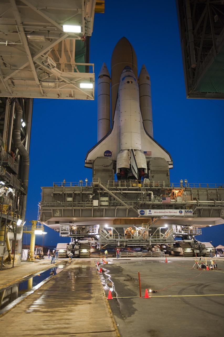 CAPE CANAVERAL, Fla. -- Space shuttle Discovery makes its nighttime trek, known as "rollout," from the Vehicle Assembly Building to Launch Pad 39A at NASA's Kennedy Space Center in Florida. It will take the shuttle, attached to its external fuel tank, twin solid rocket boosters and mobile launcher platform, about six hours to complete the move atop a crawler-transporter. Rollout sets the stage for Discovery's STS-133 crew to practice countdown and launch procedures during the Terminal Countdown Demonstration Test in mid-October. Targeted to liftoff Nov. 1, Discovery will take the Permanent Multipurpose Module (PMM) packed with supplies and critical spare parts, as well as Robonaut 2 (R2) to the International Space Station. Photo credit: NASA/Tony Gray