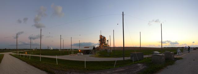 CAPE CANAVERAL, Fla. -- Space shuttle Discovery is attached to Launch Pad 39A as the sun rises over NASA's Kennedy Space Center in Florida. Later, the rotating service structure that protects the shuttle from the elements and provides access inside the vehicle will be moved into place. It took the spacecraft about six hours to make the journey, known as "rollout," from the Vehicle Assembly Building to the pad. Rollout sets the stage for Discovery's STS-133 crew to practice countdown and launch procedures during the Terminal Countdown Demonstration Test in mid-October. Targeted to liftoff Nov. 1, Discovery will take the Permanent Multipurpose Module (PMM) packed with supplies and critical spare parts, as well as Robonaut 2 (R2) to the International Space Station. Photo credit: NASA/Frankie Martin