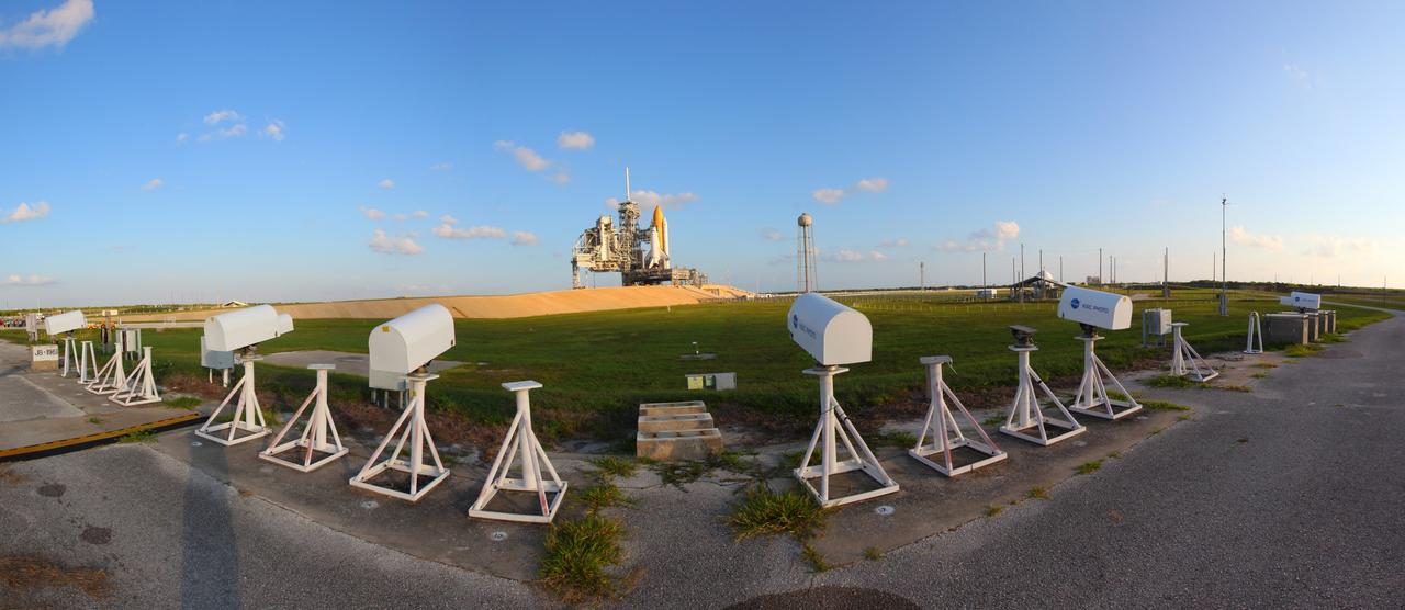 CAPE CANAVERAL, Fla. -- Space shuttle Discovery is attached to Launch Pad 39A at NASA's Kennedy Space Center in Florida. Later, the rotating service structure that protects the shuttle from the elements and provides access inside the vehicle will be moved into place. It took the spacecraft about six hours to make the journey, known as "rollout," from the Vehicle Assembly Building to the pad. Rollout sets the stage for Discovery's STS-133 crew to practice countdown and launch procedures during the Terminal Countdown Demonstration Test in mid-October. Targeted to liftoff Nov. 1, Discovery will take the Permanent Multipurpose Module (PMM) packed with supplies and critical spare parts, as well as Robonaut 2 (R2) to the International Space Station. Photo credit: NASA/Frankie Martin