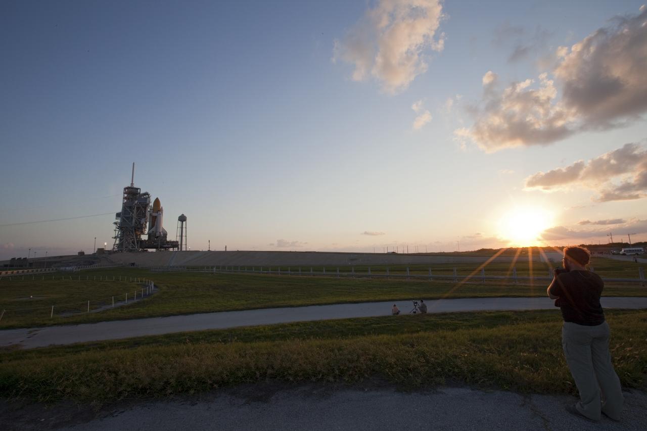 CAPE CANAVERAL, Fla. -- Space shuttle Discovery is attached to Launch Pad 39A as the sun rises over NASA's Kennedy Space Center in Florida. Later, the rotating service structure that protects the shuttle from the elements and provides access inside the vehicle will be moved into place. It took the spacecraft about six hours to make the journey, known as "rollout," from the Vehicle Assembly Building to the pad. Rollout sets the stage for Discovery's STS-133 crew to practice countdown and launch procedures during the Terminal Countdown Demonstration Test in mid-October. Targeted to liftoff Nov. 1, Discovery will take the Permanent Multipurpose Module (PMM) packed with supplies and critical spare parts, as well as Robonaut 2 (R2) to the International Space Station. Photo credit: NASA/Frankie Martin