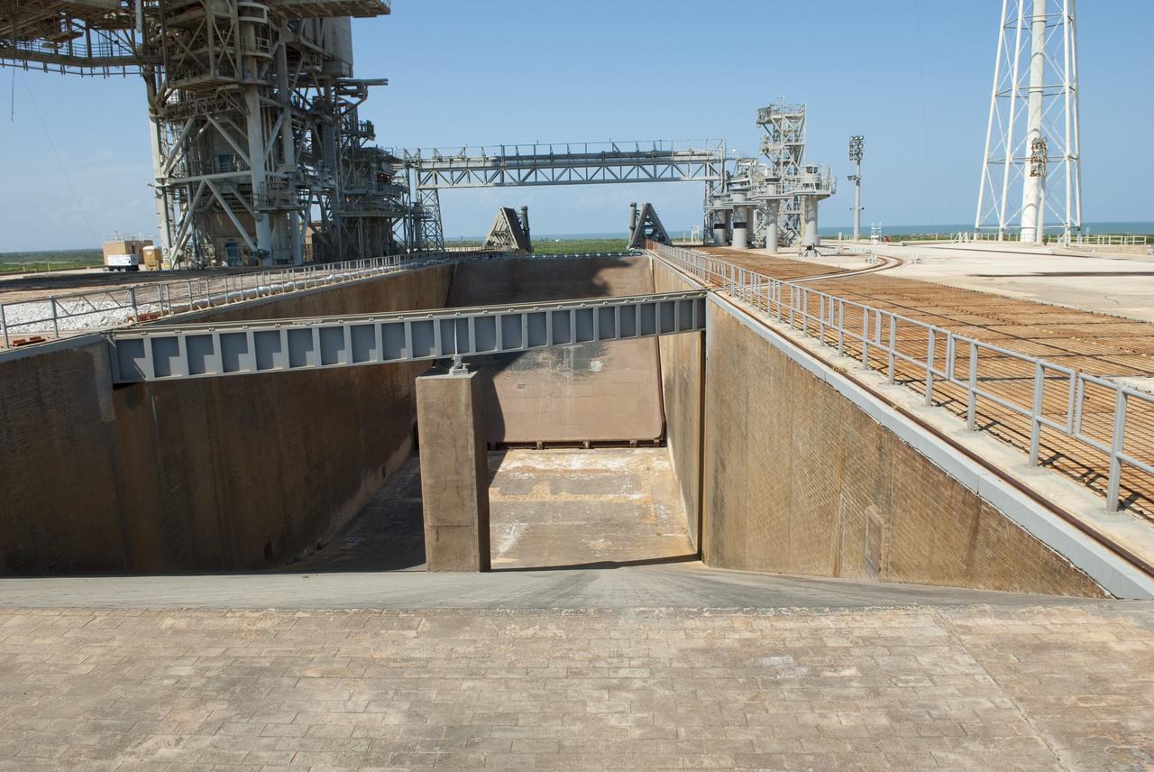 CAPE CANAVERAL, Fla. -- At NASA's Kennedy Space Center in Florida, the flame trench that serviced the launch of many space shuttles is seen cleared of all debris during deconstruction of Launch Pad 39B. The flame trench will remain as part of the new pad design for the future.          Starting in 2009, the structure at Pad B was no longer needed for NASA's Space Shuttle Program, so it is being restructured for future use. The new design will feature a "clean pad" for rockets to come with their own launcher, making it more versatile for a number of vehicles. For information on NASA's future plans, visit www.nasa.gov. Photo credit: NASA/Jim Grossmann