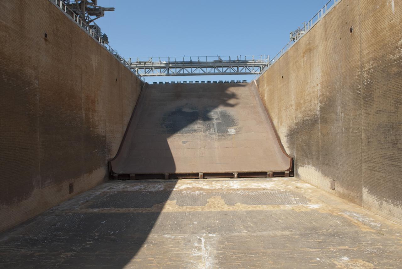 CAPE CANAVERAL, Fla. -- At NASA's Kennedy Space Center in Florida, the flame trench that serviced the launch of many space shuttles is seen from below after being cleared of all debris during deconstruction of Launch Pad 39B. The flame trench will remain as part of the new pad design for the future.          Starting in 2009, the structure at Pad B was no longer needed for NASA's Space Shuttle Program, so it is being restructured for future use. The new design will feature a "clean pad" for rockets to come with their own launcher, making it more versatile for a number of vehicles. For information on NASA's future plans, visit www.nasa.gov. Photo credit: NASA/Jim Grossmann