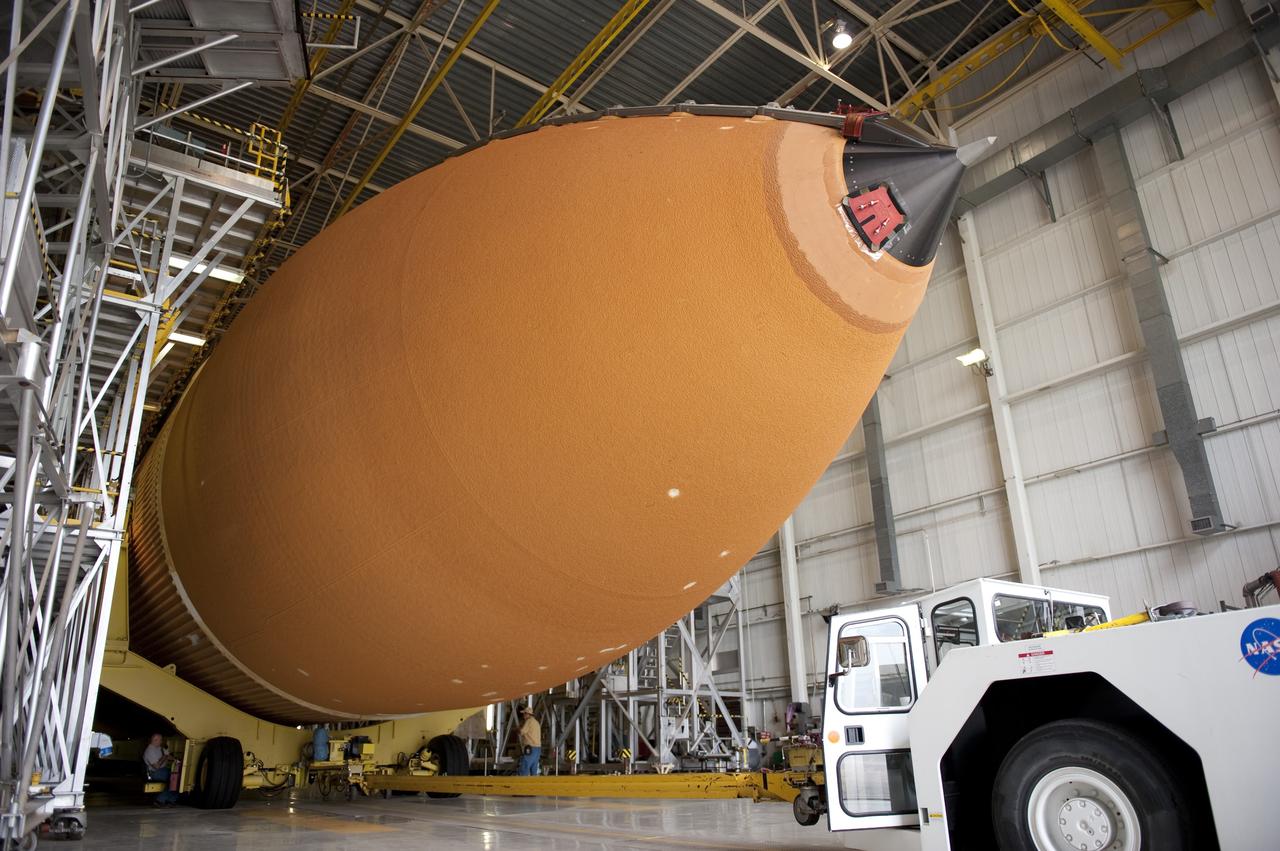 NEW ORLEANS -- Workers at NASA's Michoud Assembly Facility in New Orleans prepare the Space Shuttle Program's last external fuel tank, ET-122, for transportation to NASA's Kennedy Space Center in Florida. The tank will travel 900 miles by sea secured aboard the Pegasus Barge, offloaded and moved to Kennedy's Vehicle Assembly Building where it will be integrated to space shuttle Endeavour for the STS-134 mission to the International Space Station.        The tank, which is the largest element of the space shuttle stack, was damaged during Hurricane Katrina in August 2005 and restored to flight configuration by Lockheed Martin Space Systems Company employees. STS-134, targeted to launch Feb. 2011, currently is scheduled to be the last mission in the Space Shuttle Program. Photo credit: NASA/Kim Shiflett