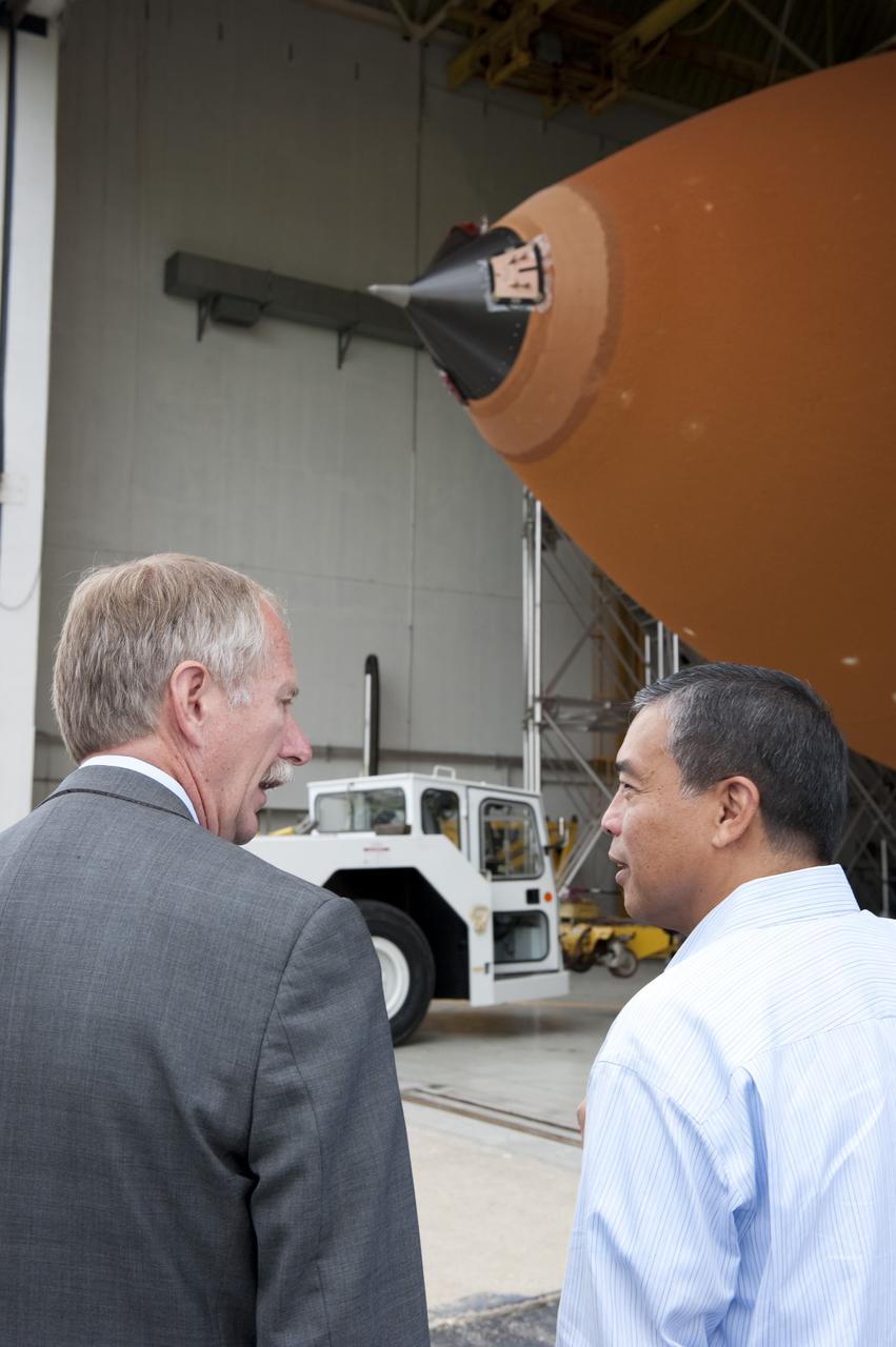 NEW ORLEANS -- Associate Administrator for Space Operations Bill Gerstenmaier and Manny Zulueta, Lockheed Martin vice president and  site executive at NASA's Michoud Assembly Facility in New Orleans, discuss the progress of the Space Shuttle Program's last external fuel tank, ET-122, as it is being transported from the facility to the Pegasus Barge. The tank will travel 900 miles by sea to NASA's Kennedy Space Center in Florida, secured aboard the barge, offloaded and moved to Kennedy's Vehicle Assembly Building where it will be integrated to space shuttle Endeavour for the STS-134 mission to the International Space Station.      The tank, which is the largest element of the space shuttle stack, was damaged during Hurricane Katrina in August 2005 and restored to flight configuration by Lockheed Martin Space Systems Company employees. STS-134, targeted to launch Feb. 2011, currently is scheduled to be the last mission in the Space Shuttle Program. Photo credit: NASA/Kim Shiflett