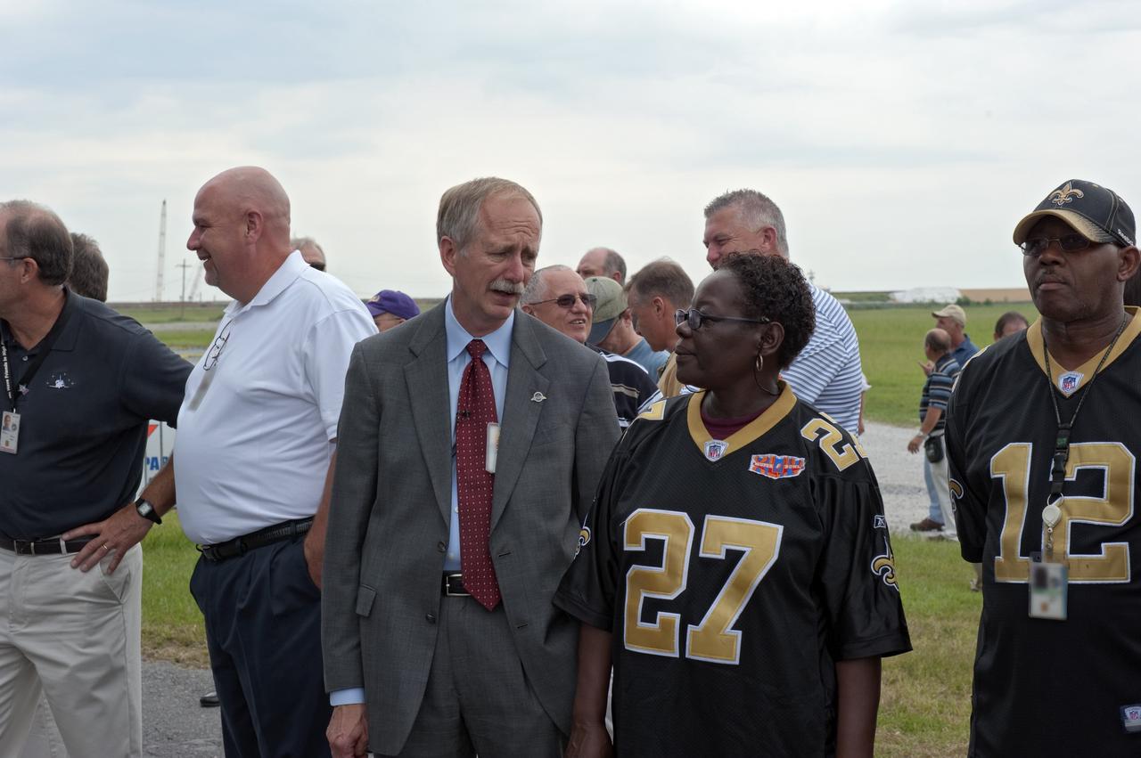 NEW ORLEANS -- At NASA's Michoud Assembly Facility in New Orleans, Associate Administrator for Space Operations Bill Gerstenmaier and a Michoud employee discuss the progress of the Space Shuttle Program's last external fuel tank, ET-122, as it is being transported from the facility to the Pegasus Barge. The tank will travel 900 miles by sea to NASA's Kennedy Space Center in Florida secured aboard the barge, offloaded and moved to Kennedy's Vehicle Assembly Building where it will be integrated to space shuttle Endeavour for the STS-134 mission to the International Space Station.      The tank, which is the largest element of the space shuttle stack, was damaged during Hurricane Katrina in August 2005 and restored to flight configuration by Lockheed Martin Space Systems Company employees. STS-134, targeted to launch Feb. 2011, currently is scheduled to be the last mission in the Space Shuttle Program. Photo credit: NASA/Kim Shiflett