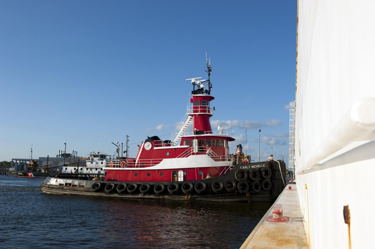 NEW ORLEANS -- At NASA's Michoud Assembly Facility in New Orleans a tug boat is prepared to escort the Space Shuttle Program's last external fuel tank, ET-122, for transportation to NASA's Kennedy Space Center in Florida. Secured aboard the Pegasus Barge the tank will travel 900 miles by sea before being offloaded and moved to Kennedy's Vehicle Assembly Building. There it will be integrated to space shuttle Endeavour for the STS-134 mission to the International Space Station. The tank, which is the largest element of the space shuttle stack, was damaged during Hurricane Katrina in August 2005 and restored to flight configuration by Lockheed Martin Space Systems Company employees. STS-134, targeted to launch Feb. 2011, currently is scheduled to be the last mission in the Space Shuttle Program. Photo credit: NASA/Kim Shiflett