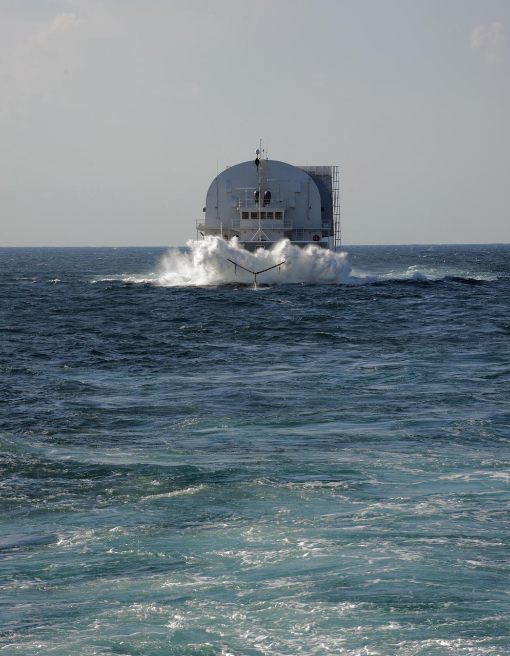 CAPE CANAVERAL, Fla. -- This view from Freedom Star, one NASA's solid rocket booster retrieval ships, shows the Pegasus Barge carrying the Space Shuttle Program's last external fuel tank, ET-122, as it is transported to NASA's Kennedy Space Center in Florida. The tank will travel 900 miles by sea before being offloaded and moved to Kennedy's Vehicle Assembly Building. There it will be integrated to space shuttle Endeavour for the STS-134 mission to the International Space Station.            The tank, which is the largest element of the space shuttle stack, was damaged during Hurricane Katrina in August 2005 and restored to flight configuration by Lockheed Martin Space Systems Company employees. STS-134, targeted to launch Feb. 2011, currently is scheduled to be the last mission in the Space Shuttle Program. Photo credit: NASA/Kim Shiflett