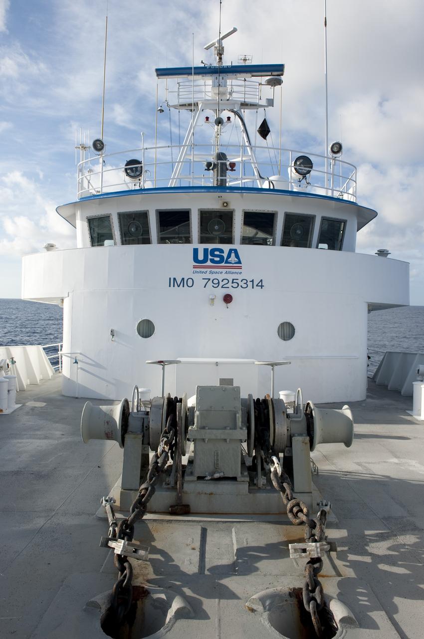 CAPE CANAVERAL, Fla. -- This view is from the deck of Freedom Star, one of NASA's solid rocket booster retrieval ships, as it pulls the Pegasus Barge carrying the Space Shuttle Program's last external fuel tank, ET-122. The tank will travel 900 miles by sea to NASA's Kennedy Space Center in Florida before being offloaded and moved to Kennedy's Vehicle Assembly Building. There it will be integrated to space shuttle Endeavour for the STS-134 mission to the International Space Station.        The tank, which is the largest element of the space shuttle stack, was damaged during Hurricane Katrina in August 2005 and restored to flight configuration by Lockheed Martin Space Systems Company employees. STS-134, targeted to launch Feb. 2011, currently is scheduled to be the last mission in the Space Shuttle Program. Photo credit: NASA/Kim Shiflett
