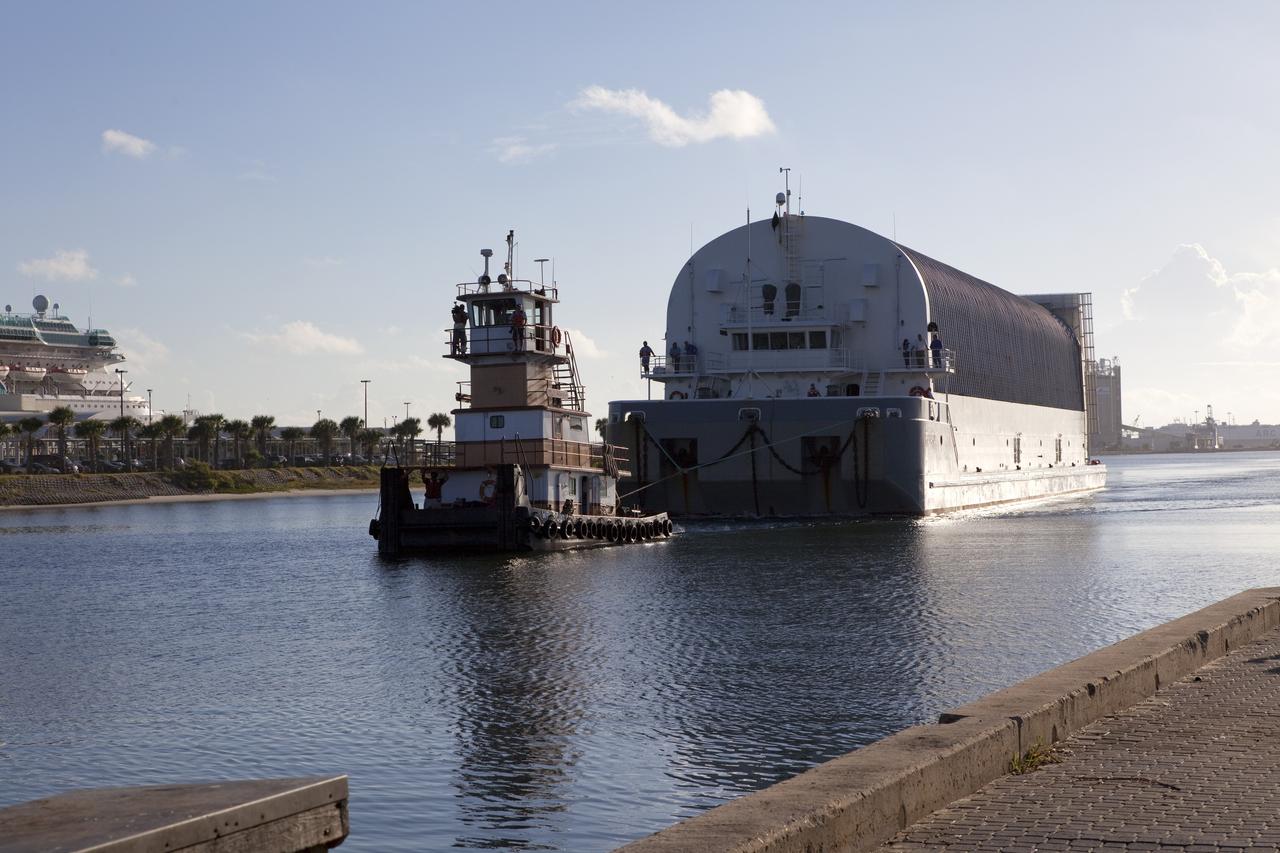 CAPE CANAVERAL, Fla. -- A tug boat pulls the Space Shuttle Program's last external fuel tank, ET-122, toward the Turn Basin at NASA's Kennedy Space Center in Florida. The tank traveled 900 miles by sea from NASA's Michoud Assembly Facility in New Orleans aboard the Pegasus Barge. Next, the tank will be offloaded and moved to Kennedy's Vehicle Assembly Building where it eventually will be attached to space shuttle Endeavour for the STS-134 mission to the International Space Station. STS-134, targeted to launch in Feb., 2011, currently is scheduled to be the last mission in the Space Shuttle Program.        The tank, which is the largest element of the space shuttle stack, was damaged during Hurricane Katrina in August 2005 and restored to flight configuration by Lockheed Martin Space Systems Company employees. Photo credit: NASA/Frankie Martin