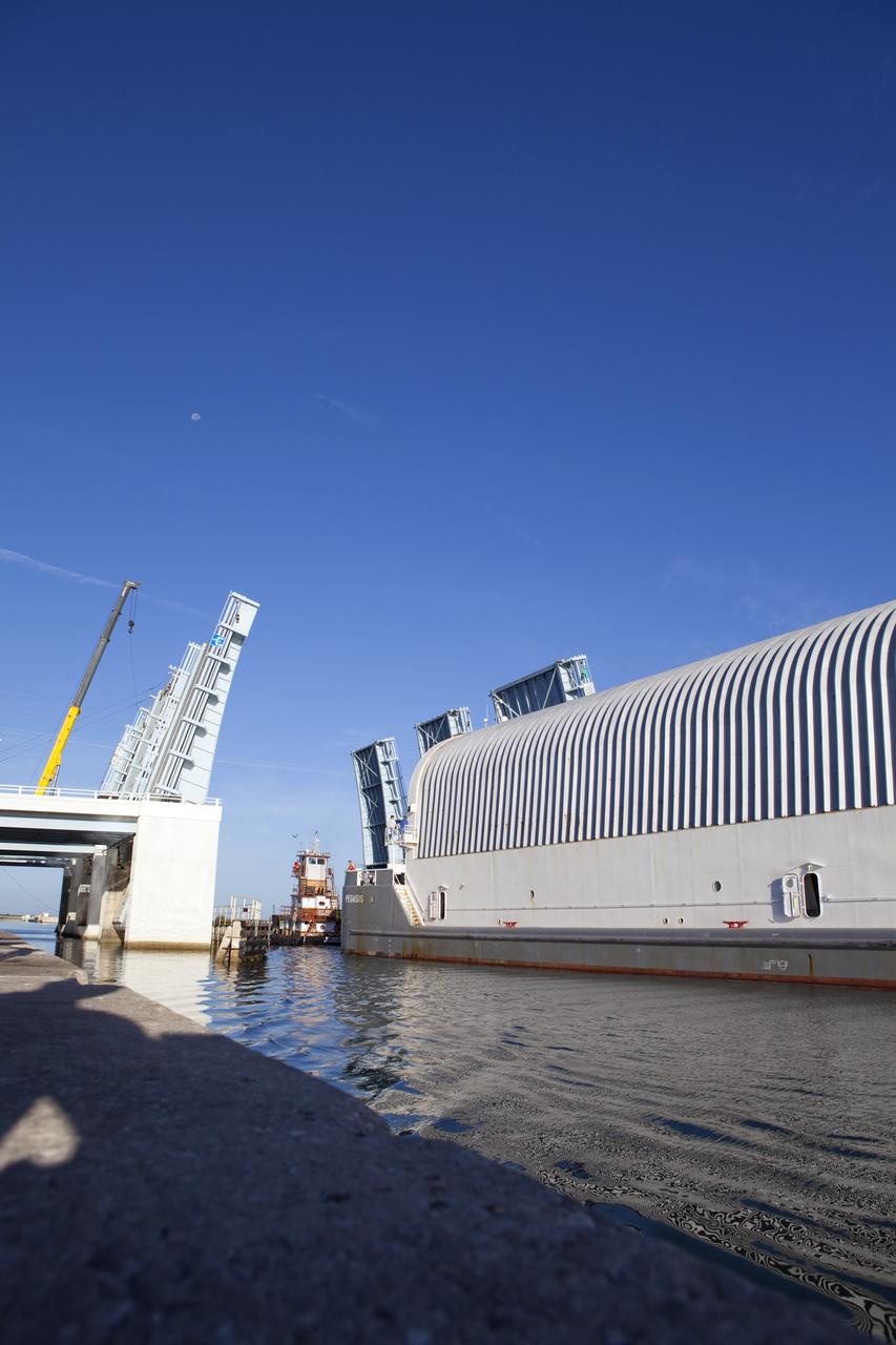 CAPE CANAVERAL, Fla. -- A tug boat pulls the Space Shuttle Program's last external fuel tank, ET-122, toward the Turn Basin at NASA's Kennedy Space Center in Florida. The tank traveled 900 miles by sea from NASA's Michoud Assembly Facility in New Orleans aboard the Pegasus Barge. Next, the tank will be offloaded and moved to Kennedy's Vehicle Assembly Building where it eventually will be attached to space shuttle Endeavour for the STS-134 mission to the International Space Station. STS-134, targeted to launch in Feb. 2011, currently is scheduled to be the last mission in the Space Shuttle Program.        The tank, which is the largest element of the space shuttle stack, was damaged during Hurricane Katrina in August 2005 and restored to flight configuration by Lockheed Martin Space Systems Company employees. Photo credit: NASA/Frankie Martin
