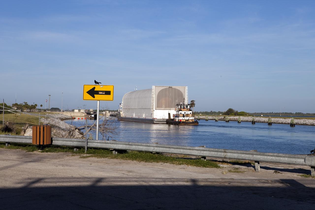 CAPE CANAVERAL, Fla. -- A tug boat pulls the Space Shuttle Program's last external fuel tank, ET-122, toward the Turn Basin at NASA's Kennedy Space Center in Florida. The tank traveled 900 miles by sea from NASA's Michoud Assembly Facility in New Orleans aboard the Pegasus Barge. Next, the tank will be offloaded and moved to Kennedy's Vehicle Assembly Building where it eventually will be attached to space shuttle Endeavour for the STS-134 mission to the International Space Station. STS-134, targeted to launch in Feb., 2011, currently is scheduled to be the last mission in the Space Shuttle Program.        The tank, which is the largest element of the space shuttle stack, was damaged during Hurricane Katrina in August 2005 and restored to flight configuration by Lockheed Martin Space Systems Company employees. Photo credit: NASA/Frankie Martin