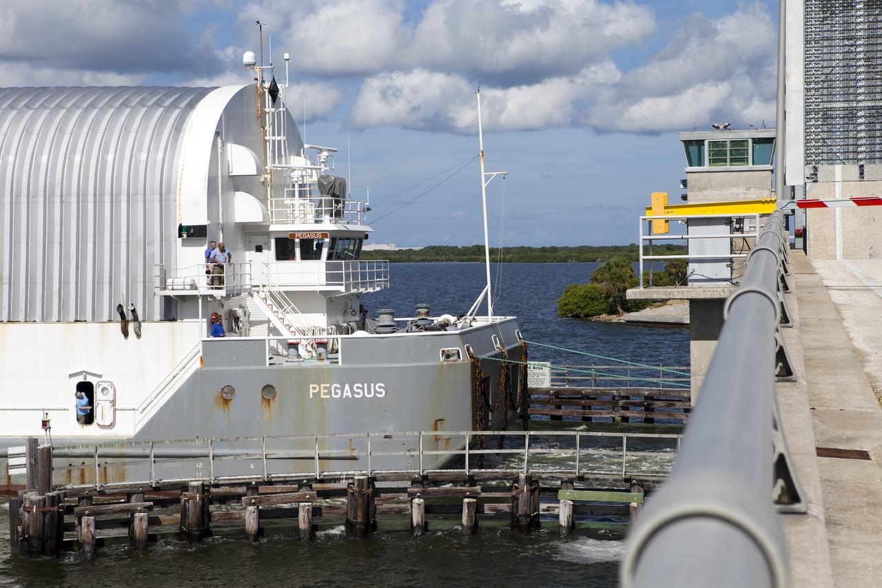 CAPE CANAVERAL, Fla. -- At NASA's Kennedy Space Center in Florida, the Pegasus Barge, carrying the Space Shuttle Program's last external fuel tank, ET-122, arrives at the Turn Basin. The tank traveled 900 miles by sea from NASA's Michoud Assembly Facility in New Orleans. Next, the tank will be offloaded and moved to Kennedy's Vehicle Assembly Building where it eventually will be attached to space shuttle Endeavour for the STS-134 mission to the International Space Station. STS-134, targeted to launch in Feb. 2011, currently is scheduled to be the last mission in the Space Shuttle Program.        The tank, which is the largest element of the space shuttle stack, was damaged during Hurricane Katrina in August 2005 and restored to flight configuration by Lockheed Martin Space Systems Company employees. Photo credit: NASA/Frankie Martin