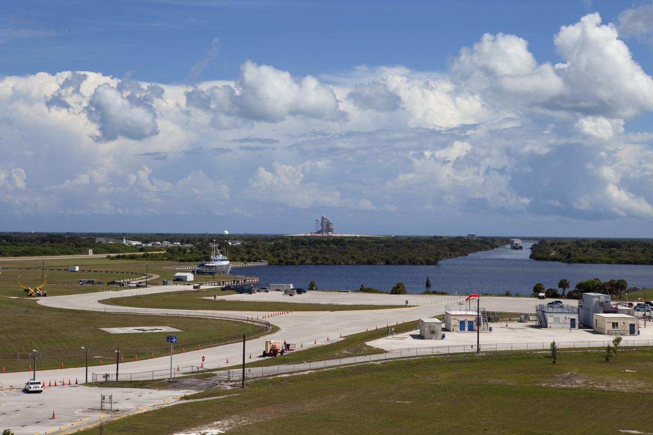 CAPE CANAVERAL, Fla. -- A tug boat pulls the Space Shuttle Program's last external fuel tank, ET-122, to the Turn Basin at NASA's Kennedy Space Center in Florida. The tank traveled 900 miles by sea from NASA's Michoud Assembly Facility in New Orleans aboard the Pegasus Barge. Next, the tank will be offloaded and moved to Kennedy's Vehicle Assembly Building where it eventually will be attached to space shuttle Endeavour for the STS-134 mission to the International Space Station. STS-134, targeted to launch in Feb. 2011, currently is scheduled to be the last mission in the Space Shuttle Program.        The tank, which is the largest element of the space shuttle stack, was damaged during Hurricane Katrina in August 2005 and restored to flight configuration by Lockheed Martin Space Systems Company employees. Photo credit: NASA/Frankie Martin