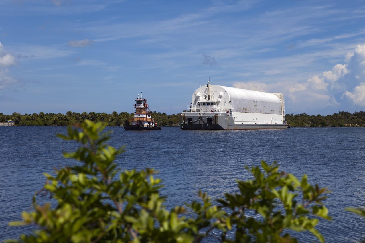 CAPE CANAVERAL, Fla. -- A tug boat pulls the Space Shuttle Program's last external fuel tank, ET-122, to the Turn Basin at NASA's Kennedy Space Center in Florida. The tank traveled 900 miles by sea from NASA's Michoud Assembly Facility in New Orleans aboard the Pegasus Barge. Next, the tank will be offloaded and moved to Kennedy's Vehicle Assembly Building where it eventually will be attached to space shuttle Endeavour for the STS-134 mission to the International Space Station. STS-134, targeted to launch in Feb. 2011, currently is scheduled to be the last mission in the Space Shuttle Program.        The tank, which is the largest element of the space shuttle stack, was damaged during Hurricane Katrina in August 2005 and restored to flight configuration by Lockheed Martin Space Systems Company employees. Photo credit: NASA/Frankie Martin