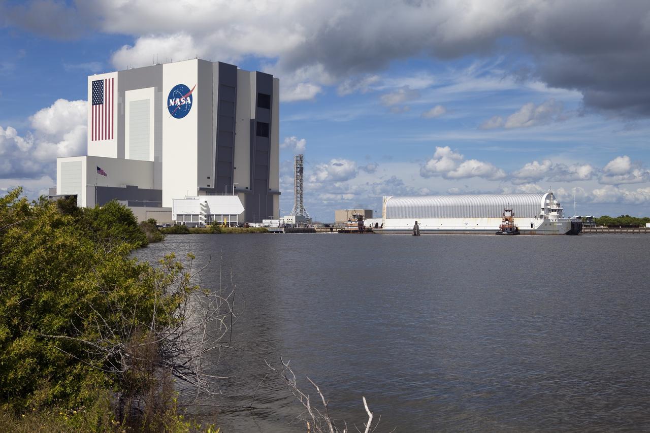 CAPE CANAVERAL, Fla. -- At NASA's Kennedy Space Center in Florida, the Pegasus Barge, carrying the Space Shuttle Program's last external fuel tank, ET-122, arrives at the Turn Basin. The tank traveled 900 miles by sea from NASA's Michoud Assembly Facility in New Orleans. Next, the tank will be offloaded and moved to Kennedy's Vehicle Assembly Building where it eventually will be attached to space shuttle Endeavour for the STS-134 mission to the International Space Station. STS-134, targeted to launch in Feb. 2011, currently is scheduled to be the last mission in the Space Shuttle Program.        The tank, which is the largest element of the space shuttle stack, was damaged during Hurricane Katrina in August 2005 and restored to flight configuration by Lockheed Martin Space Systems Company employees. Photo credit: NASA/Frankie Martin