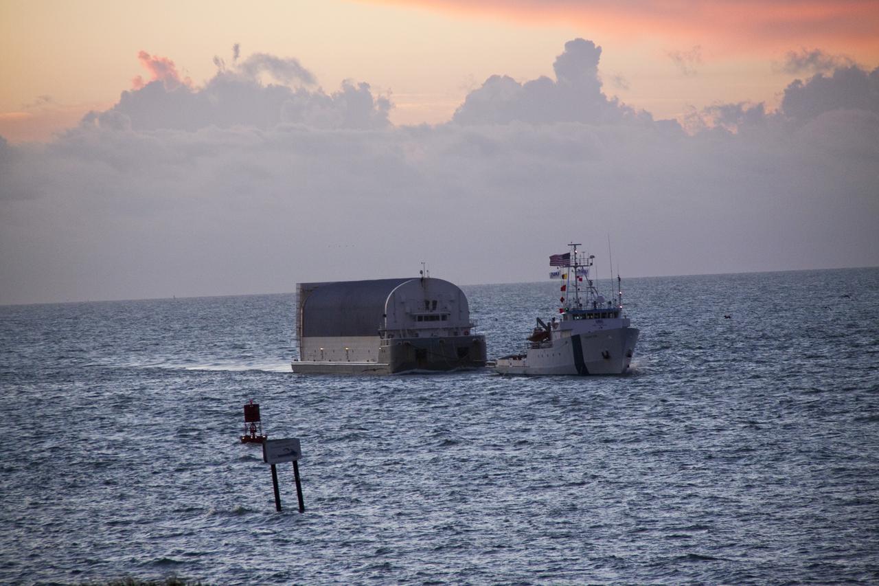 CAPE CANAVERAL, Fla. -- Freedom Star, one of NASA's solid rocket booster retrieval ships, pulls the Space Shuttle Program's last external fuel tank, ET-122, toward NASA's Kennedy Space Center in Florida. The tank traveled 900 miles by sea from NASA's Michoud Assembly Facility in New Orleans aboard the Pegasus Barge. After reaching the Turn Basin at Kennedy, the tank will be offloaded and moved to the Vehicle Assembly Building where it eventually will be attached to space shuttle Endeavour for the STS-134 mission to the International Space Station. STS-134, targeted to launch in Feb. 2011, currently is scheduled to be the last mission in the Space Shuttle Program.       The tank, which is the largest element of the space shuttle stack, was damaged during Hurricane Katrina in August 2005 and restored to flight configuration by Lockheed Martin Space Systems Company employees. Photo credit: NASA/Jack Pfaller