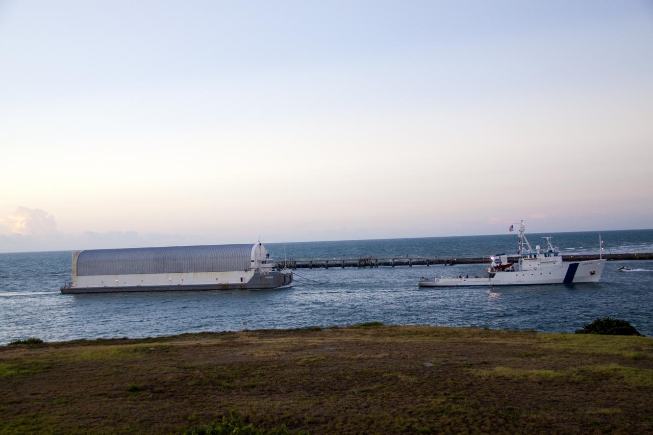 CAPE CANAVERAL, Fla. -- Freedom Star, one of NASA's solid rocket booster retrieval ships, pulls the Space Shuttle Program's last external fuel tank, ET-122, toward NASA's Kennedy Space Center in Florida. The tank traveled 900 miles by sea from NASA's Michoud Assembly Facility in New Orleans aboard the Pegasus Barge. After reaching the Turn Basin at Kennedy, the tank will be offloaded and moved to the Vehicle Assembly Building where it eventually will be attached to space shuttle Endeavour for the STS-134 mission to the International Space Station. STS-134, targeted to launch in Feb. 2011, currently is scheduled to be the last mission in the Space Shuttle Program.        The tank, which is the largest element of the space shuttle stack, was damaged during Hurricane Katrina in August 2005 and restored to flight configuration by Lockheed Martin Space Systems Company employees. Photo credit: NASA/Jack Pfaller