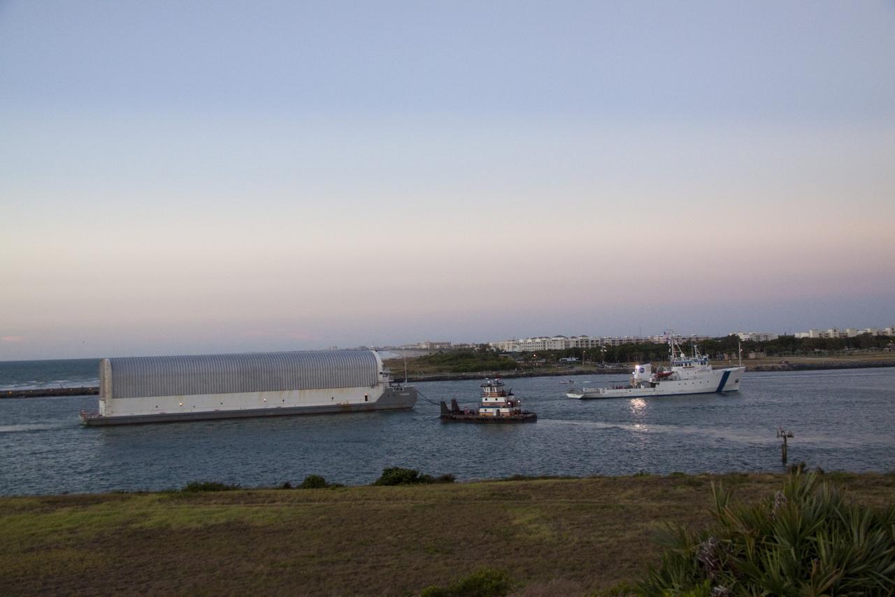 CAPE CANAVERAL, Fla. -- Freedom Star, one of NASA's solid rocket booster retrieval ships, pulls the Space Shuttle Program's last external fuel tank, ET-122, toward NASA's Kennedy Space Center in Florida. The tank traveled 900 miles by sea from NASA's Michoud Assembly Facility in New Orleans aboard the Pegasus Barge. After reaching the Turn Basin at Kennedy, the tank will be offloaded and moved to the Vehicle Assembly Building where it eventually will be attached to space shuttle Endeavour for the STS-134 mission to the International Space Station. STS-134, targeted to launch in Feb. 2011, currently is scheduled to be the last mission in the Space Shuttle Program.        The tank, which is the largest element of the space shuttle stack, was damaged during Hurricane Katrina in August 2005 and restored to flight configuration by Lockheed Martin Space Systems Company employees. Photo credit: NASA/Jack Pfaller