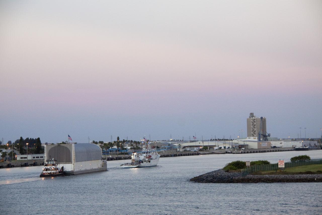 CAPE CANAVERAL, Fla. -- Freedom Star, one of NASA's solid rocket booster retrieval ships, pulls the Space Shuttle Program's last external fuel tank, ET-122, toward NASA's Kennedy Space Center in Florida. The tank traveled 900 miles by sea from NASA's Michoud Assembly Facility in New Orleans aboard the Pegasus Barge. After reaching the Turn Basin at Kennedy, the tank will be offloaded and moved to the Vehicle Assembly Building where it eventually will be attached to space shuttle Endeavour for the STS-134 mission to the International Space Station. STS-134, targeted to launch in Feb. 2011, currently is scheduled to be the last mission in the Space Shuttle Program.         The tank, which is the largest element of the space shuttle stack, was damaged during Hurricane Katrina in August 2005 and restored to flight configuration by Lockheed Martin Space Systems Company employees. Photo credit: NASA/Jack Pfaller