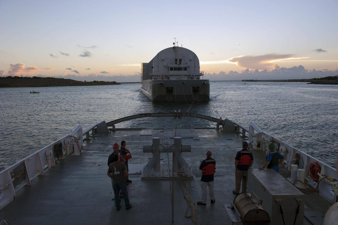 CAPE CANAVERAL, Fla. -- Freedom Star, one of NASA's solid rocket booster retrieval ships, pulls the Space Shuttle Program's last external fuel tank, ET-122, toward NASA's Kennedy Space Center in Florida. The tank traveled 900 miles by sea from NASA's Michoud Assembly Facility in New Orleans aboard the Pegasus Barge. After reaching the Turn Basin at Kennedy, the tank will be offloaded and moved to the Vehicle Assembly Building where it eventually will be attached to space shuttle Endeavour for the STS-134 mission to the International Space Station. STS-134, targeted to launch in Feb. 2011, currently is scheduled to be the last mission in the Space Shuttle Program.           The tank, which is the largest element of the space shuttle stack, was damaged during Hurricane Katrina in August 2005 and restored to flight configuration by Lockheed Martin Space Systems Company employees. Photo credit: NASA/Kim Shiflett