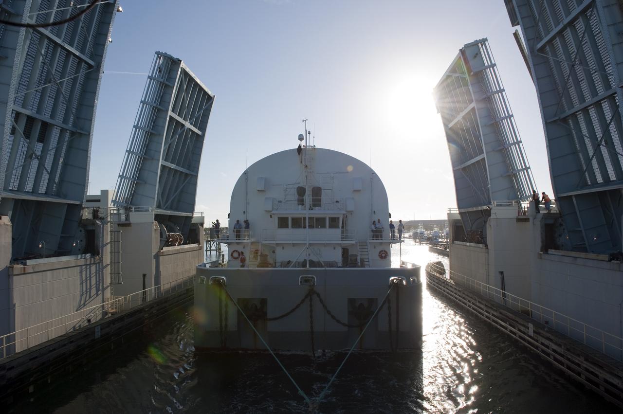 CAPE CANAVERAL, Fla. -- NASA's Pegasus barge moves through the bridge at Port Canaveral, Fla. The barge is carrying the Space Shuttle Program's last external fuel tank, ET-122, toward NASA's Kennedy Space Center in Florida. The tank traveled 900 miles by sea from NASA's Michoud Assembly Facility in New Orleans. After reaching the Turn Basin at Kennedy, the tank will be offloaded and moved to the Vehicle Assembly Building where it eventually will be attached to space shuttle Endeavour for the STS-134 mission to the International Space Station. STS-134, targeted to launch in Feb. 2011, currently is scheduled to be the last mission in the Space Shuttle Program.         The tank, which is the largest element of the space shuttle stack, was damaged during Hurricane Katrina in August 2005 and restored to flight configuration by Lockheed Martin Space Systems Company employees. Photo credit: NASA/Kim Shiflett