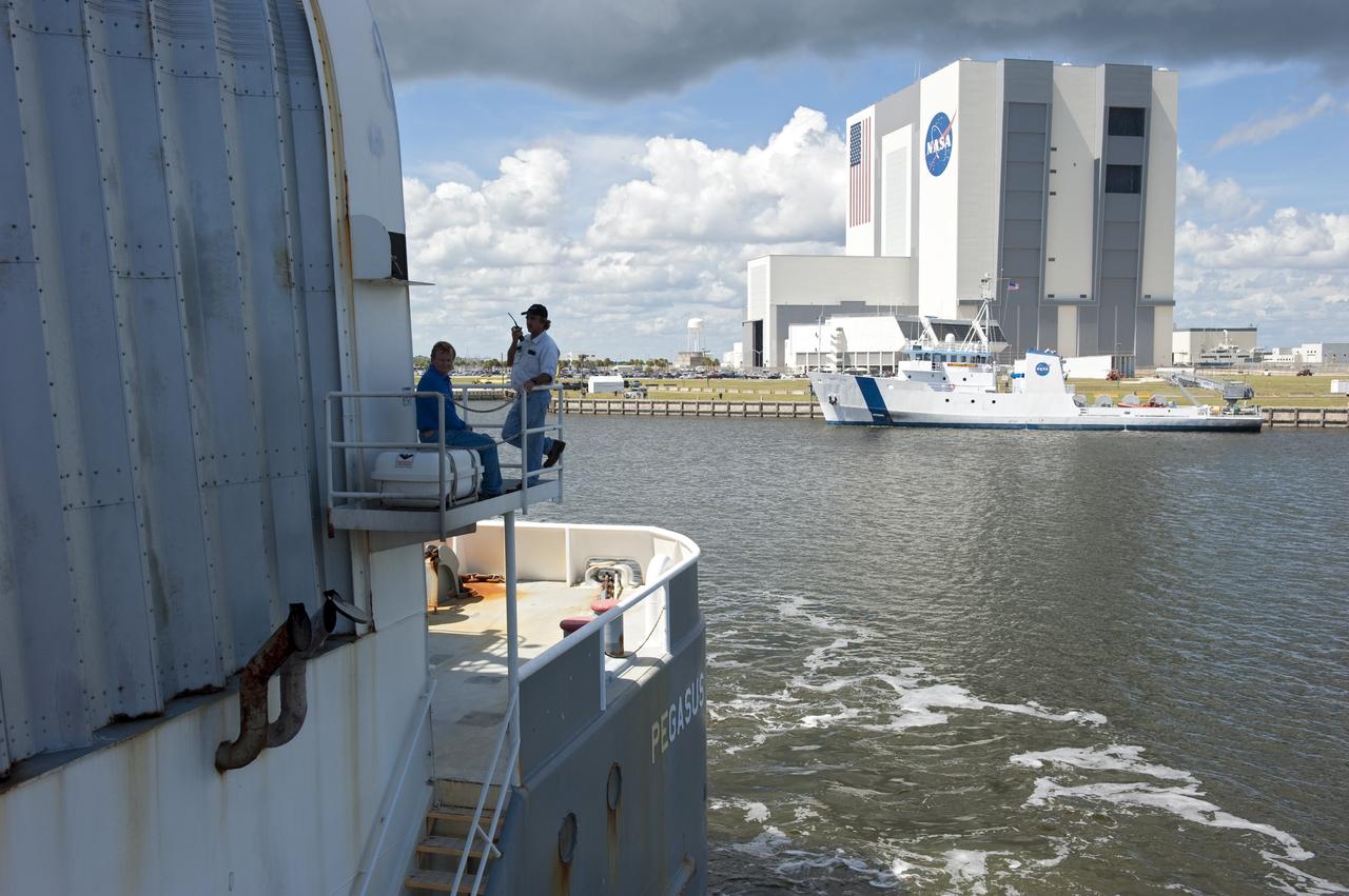 CAPE CANAVERAL, Fla. -- NASA's Pegasus barge, carrying the Space Shuttle Program's last external fuel tank, ET-122, arrives at the Turn Basin of NASA's Kennedy Space Center in Florida. The tank traveled 900 miles by sea from NASA's Michoud Assembly Facility in New Orleans. Next, the tank will be offloaded and moved to the Vehicle Assembly Building where it eventually will be attached to space shuttle Endeavour for the STS-134 mission to the International Space Station. STS-134, targeted to launch in Feb. 2011, currently is scheduled to be the last mission in the Space Shuttle Program.         The tank, which is the largest element of the space shuttle stack, was damaged during Hurricane Katrina in August 2005 and restored to flight configuration by Lockheed Martin Space Systems Company employees. Photo credit: NASA/Kim Shiflett