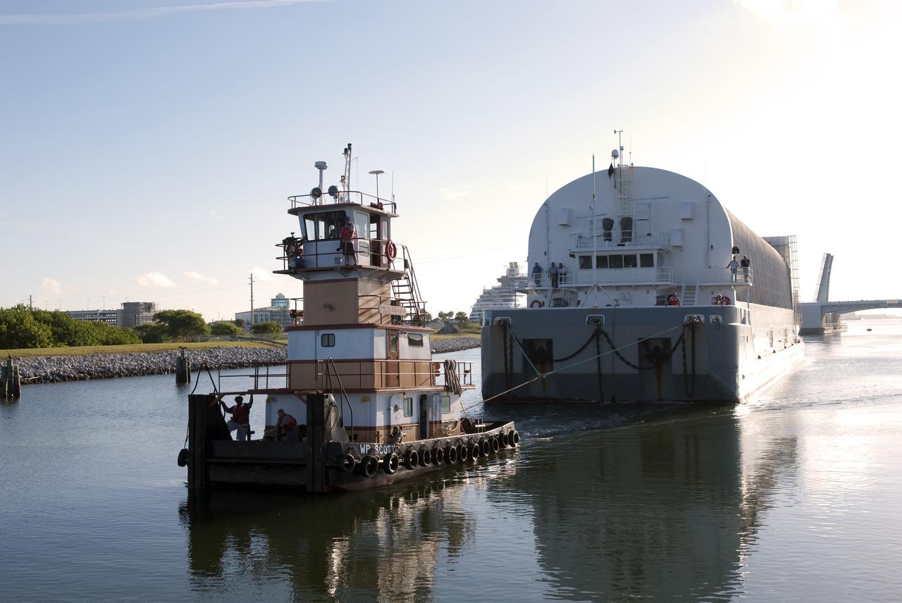 CAPE CANAVERAL, Fla. -- A tugboat pulls the Pegasus Barge carrying the Space Shuttle Program's last external fuel tank, ET-122, toward NASA's Kennedy Space Center in Florida. The tank traveled 900 miles by sea from NASA's Michoud Assembly Facility in New Orleans. After reaching the Turn Basin at Kennedy, the tank will be offloaded and moved to the Vehicle Assembly Building where it eventually will be attached to space shuttle Endeavour for the STS-134 mission to the International Space Station. STS-134, targeted to launch in Feb. 2011, currently is scheduled to be the last mission in the Space Shuttle Program.           The tank, which is the largest element of the space shuttle stack, was damaged during Hurricane Katrina in August 2005 and restored to flight configuration by Lockheed Martin Space Systems Company employees. Photo credit: NASA/Jim Grossmann