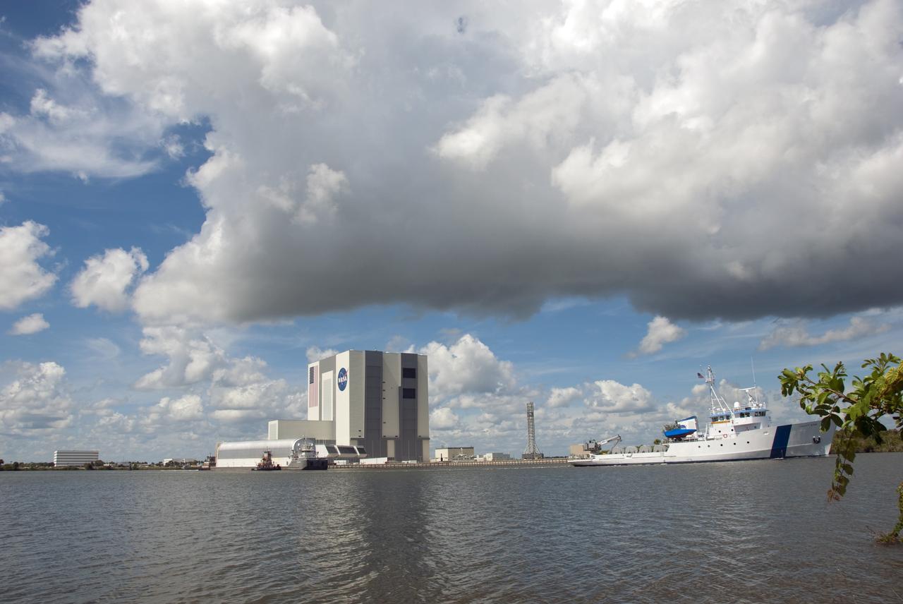 CAPE CANAVERAL, Fla. -- NASA's Pegasus barge, which was ushered by two tug boats and Liberty Star, arrives at NASA's Kennedy Space Center in Florida. The barge is carrying the Space Shuttle Program's last external fuel tank, ET-122 and traveled 900 miles by sea from NASA's Michoud Assembly Facility in New Orleans. Next, the tank will be offloaded and moved to the Vehicle Assembly Building where it eventually will be attached to space shuttle Endeavour for the STS-134 mission to the International Space Station. STS-134, targeted to launch in Feb. 2011, currently is scheduled to be the last mission in the Space Shuttle Program.            The tank, which is the largest element of the space shuttle stack, was damaged during Hurricane Katrina in August 2005 and restored to flight configuration by Lockheed Martin Space Systems Company employees. Photo credit: NASA/Jim Grossmann