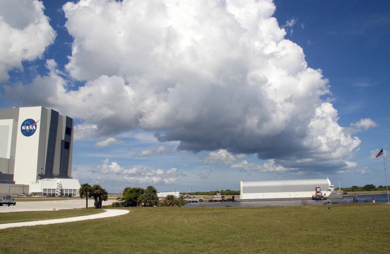 CAPE CANAVERAL, Fla. -- The Pegasus Barge carrying the Space Shuttle Program's last external fuel tank, ET-122, arrives at the Turn Basin at NASA's Kennedy Space Center in Florida. The tank traveled 900 miles by sea from NASA's Michoud Assembly Facility in New Orleans. Next, the tank will be offloaded and moved to the Vehicle Assembly Building where it eventually will be attached to space shuttle Endeavour for the STS-134 mission to the International Space Station. STS-134, targeted to launch in Feb. 2011, currently is scheduled to be the last mission in the Space Shuttle Program.           The tank, which is the largest element of the space shuttle stack, was damaged during Hurricane Katrina in August 2005 and restored to flight configuration by Lockheed Martin Space Systems Company employees. Photo credit: NASA/Jack Pfaller
