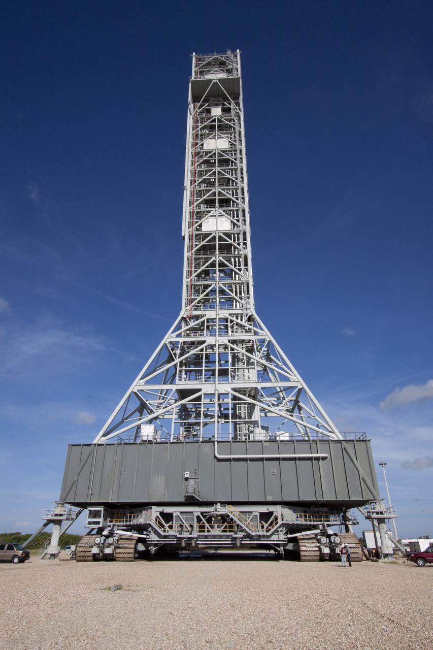 CAPE CANAVERAL, Fla. -- At NASA's Kennedy Space Center in Florida, a crawler-transporter is in place under NASA's new mobile launcher (ML) support structure. The crawler will transport the ML from a construction site, north of the Vehicle Assembly Building, to the Mobile Launcher east park site. Once there, the ML can be outfitted with ground support equipment, such as umbilicals and access arms, for future rocket launches. It took about two years to construct the 355-foot-tall structure, which will support NASA's future human spaceflight program. The base of the launcher is lighter than space shuttle mobile launcher platforms so the crawler-transporter can pick up the heavier load of the tower and a taller rocket. Photo credit: NASA/Jack Pfaller