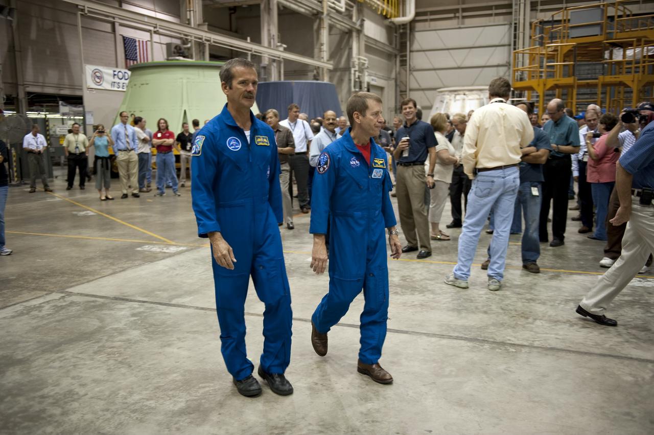 CAPE CANAVERAL, Fla. -- At NASA's Kennedy Space Center in Florida, Canadian Space Agency astronaut Chris Hadfield (left) and NASA astronaut Gregory C. Johnson attend a ceremony being held to commemorate the move from Kennedy's Assembly Refurbishment Facility (ARF) to the Vehicle Assembly Building (VAB) of the Space Shuttle Program's final solid rocket booster structural assembly -- the right-hand forward. The move was postponed because of inclement weather. Photo credit: NASA/Kim Shiflett
