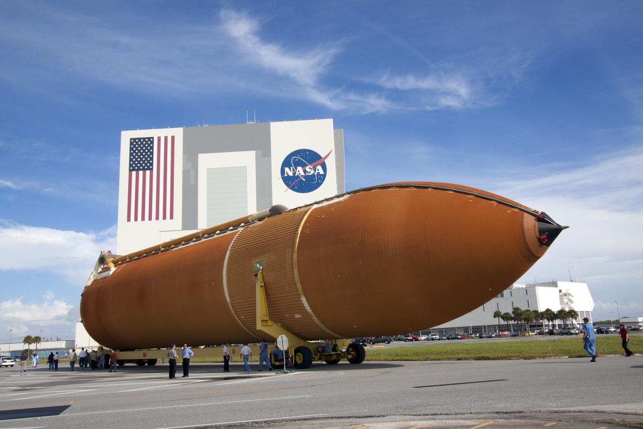 CAPE CANAVERAL, Fla. -- The Space Shuttle Program's last external fuel tank, ET-122, moves from the Turn Basin to the Vehicle Assembly Building at NASA's Kennedy Space Center in Florida. The tank traveled 900 miles by sea from NASA's Michoud Assembly Facility in New Orleans aboard the Pegasus Barge. Once inside the Vehicle Assembly Building, it eventually will be attached to space shuttle Endeavour for the STS-134 mission to the International Space Station. STS-134, targeted to launch in Feb. 2011, currently is scheduled to be the last mission in the shuttle program.          The tank, which is the largest element of the space shuttle stack, was damaged during Hurricane Katrina in August 2005 and restored to flight configuration by Lockheed Martin Space Systems Company employees. Photo credit: NASA/Jack Pfaller