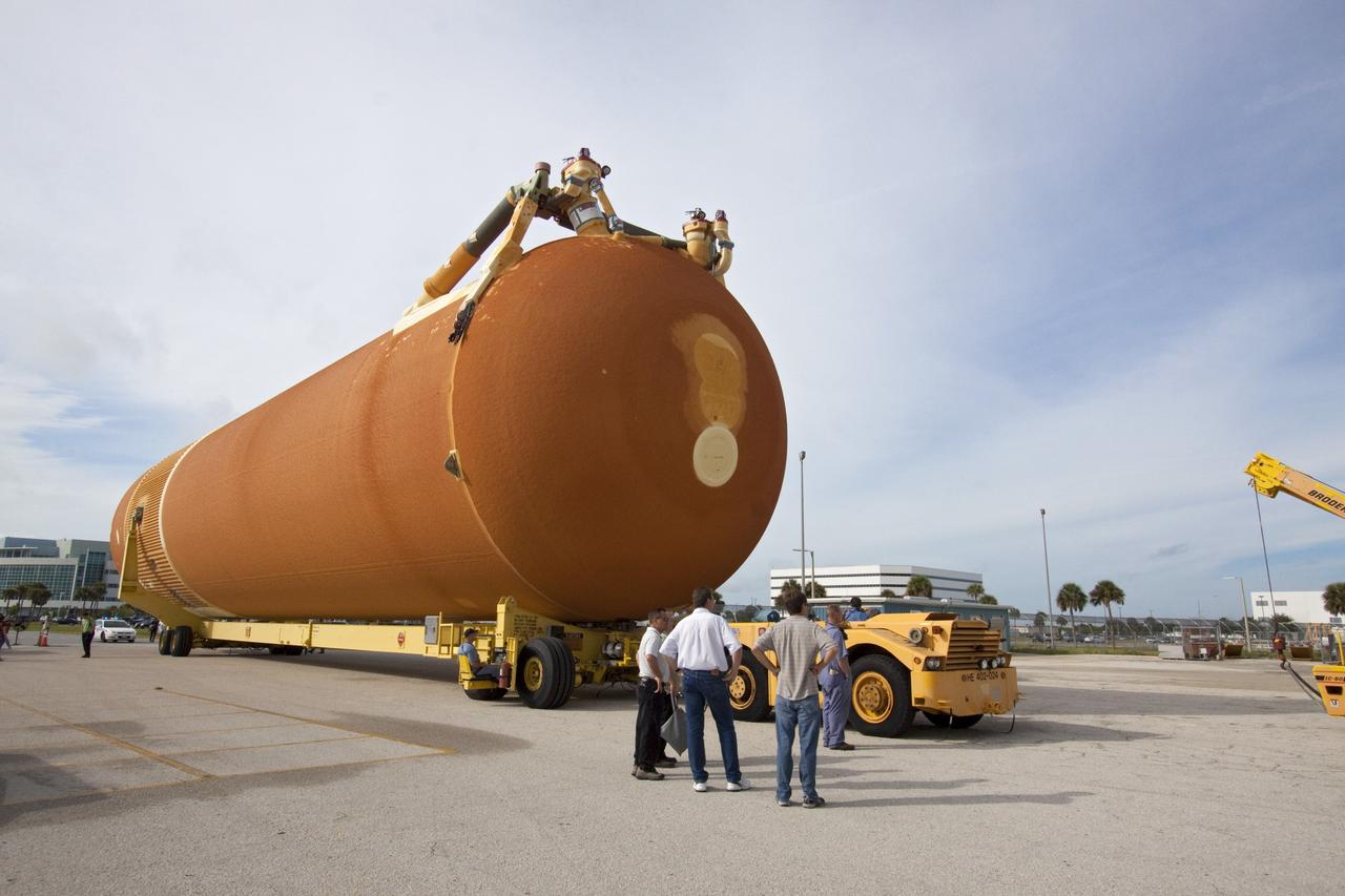 CAPE CANAVERAL, Fla. -- The Space Shuttle Program's last external fuel tank, ET-122, moves from the Turn Basin to the Vehicle Assembly Building at NASA's Kennedy Space Center in Florida. The tank traveled 900 miles by sea from NASA's Michoud Assembly Facility in New Orleans aboard the Pegasus Barge. Once inside the Vehicle Assembly Building, it eventually will be attached to space shuttle Endeavour for the STS-134 mission to the International Space Station. STS-134, targeted to launch in Feb. 2011, currently is scheduled to be the last mission in the shuttle program.          The tank, which is the largest element of the space shuttle stack, was damaged during Hurricane Katrina in August 2005 and restored to flight configuration by Lockheed Martin Space Systems Company employees. Photo credit: NASA/Jack Pfaller