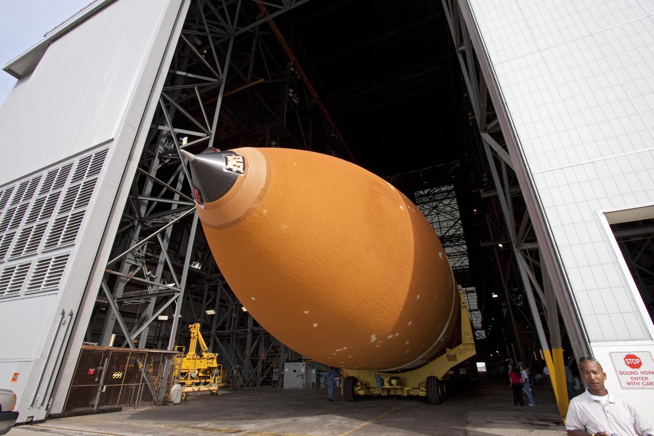 CAPE CANAVERAL, Fla. -- The Space Shuttle Program's last external fuel tank, ET-122, enters the Vehicle Assembly Building at NASA's Kennedy Space Center in Florida. The tank traveled 900 miles by sea from NASA's Michoud Assembly Facility in New Orleans to Kennedy's Turn Basin aboard the Pegasus Barge. The tank eventually will be attached to space shuttle Endeavour for the STS-134 mission to the International Space Station. STS-134, targeted to launch in Feb. 2011, currently is scheduled to be the last mission in the shuttle program.          The tank, which is the largest element of the space shuttle stack, was damaged during Hurricane Katrina in August 2005 and restored to flight configuration by Lockheed Martin Space Systems Company employees. Photo credit: NASA/Jack Pfaller