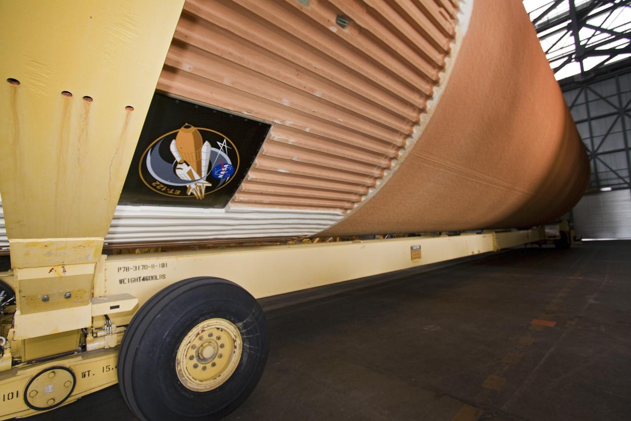 CAPE CANAVERAL, Fla. -- To commemorate the history of the Space Shuttle Program's last external fuel tank, its intertank door is emblazoned with an ET-122 insignia. The tank is in the Vehicle Assembly Building at NASA's Kennedy Space Center in Florida after traveling 900 miles by sea from NASA's Michoud Assembly Facility in New Orleans aboard the Pegasus Barge. It eventually will be attached to space shuttle Endeavour for the STS-134 mission to the International Space Station. STS-134, targeted to launch in Feb. 2011, currently is scheduled to be the last mission in the shuttle program.           The tank, which is the largest element of the space shuttle stack, was completed in 2002, modified during Return to Flight operations in 2003 and 2004, damaged during Hurricane Katrina in 2005, and then restored to flight configuration by Lockheed Martin Space Systems Company employees in 2008 at NASA's Marshall Space Flight Center in Alabama. Photo credit: NASA/Jack Pfaller