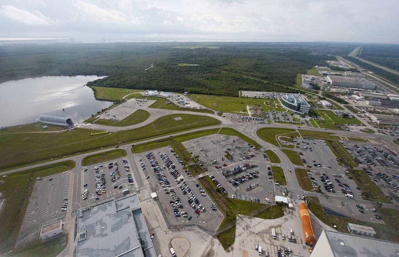 CAPE CANAVERAL, Fla. -- This overhead view shows the Space Shuttle Program's last external fuel tank, ET-122 (right), as it is being transported to the Vehicle Assembly Building (VAB) at NASA's Kennedy Space Center in Florida.          The tank traveled 900 miles by sea, carried in the Pegasus Barge, from NASA's Michoud Assembly Facility in New Orleans. Once inside the VAB, it eventually will be attached to space shuttle Endeavour for the STS-134 mission to the International Space Station targeted to launch Feb. 2011. STS-134 currently is scheduled to be the last mission in the shuttle program. The tank, which is the largest element of the space shuttle stack, was damaged during Hurricane Katrina in August 2005 and restored to flight configuration by Lockheed Martin Space Systems Company employees. Photo credit: NASA/Kevin O'Connell