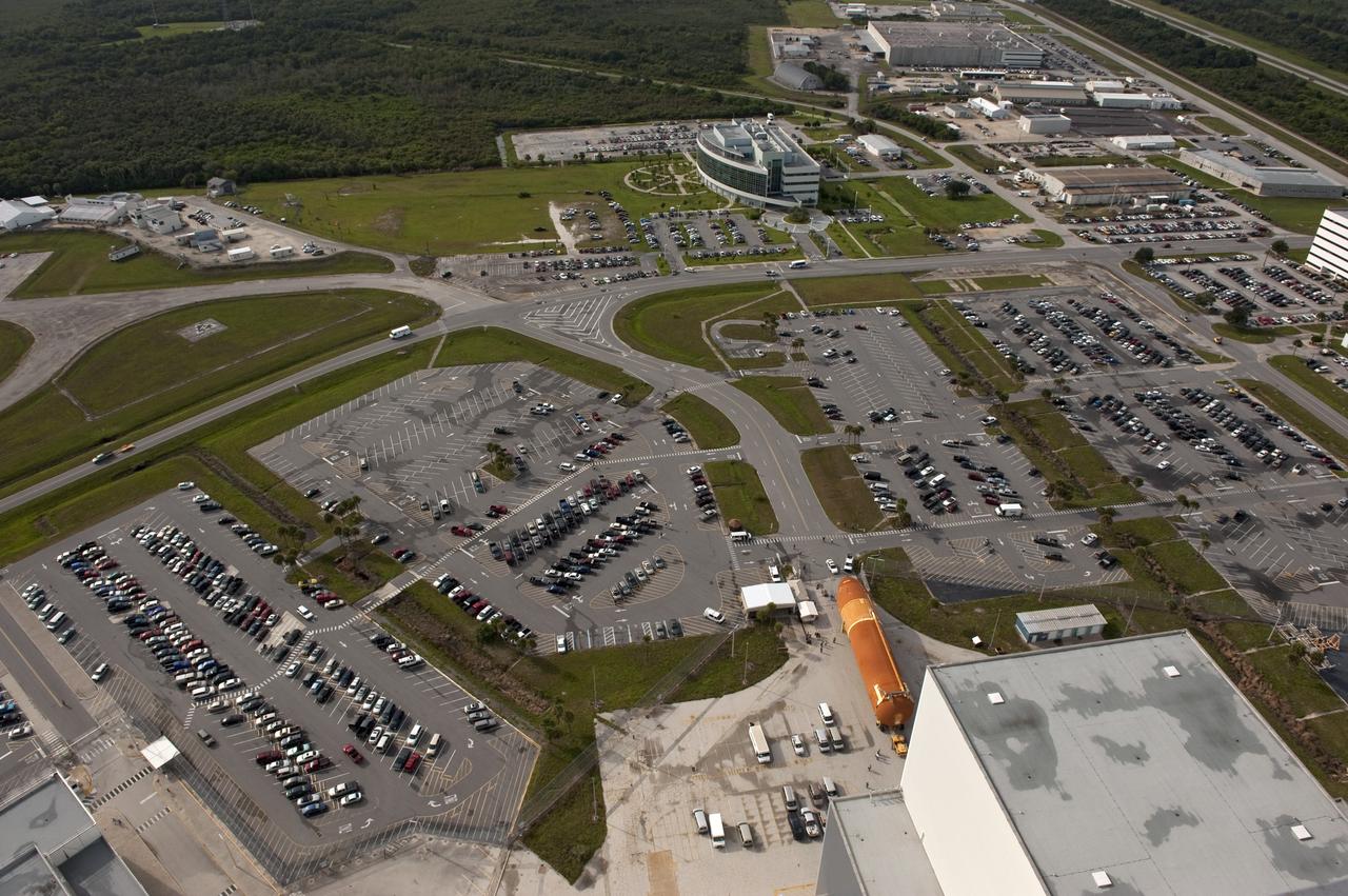 CAPE CANAVERAL, Fla. -- This overhead view shows the Space Shuttle Program's last external fuel tank, ET-122 (right), as it is being transported to the Vehicle Assembly Building (VAB) at NASA's Kennedy Space Center in Florida.          The tank traveled 900 miles by sea, carried in the Pegasus Barge, from NASA's Michoud Assembly Facility in New Orleans. Once inside the VAB, it eventually will be attached to space shuttle Endeavour for the STS-134 mission to the International Space Station targeted to launch Feb. 2011. STS-134 currently is scheduled to be the last mission in the shuttle program. The tank, which is the largest element of the space shuttle stack, was damaged during Hurricane Katrina in August 2005 and restored to flight configuration by Lockheed Martin Space Systems Company employees. Photo credit: NASA/Kevin O'Connell