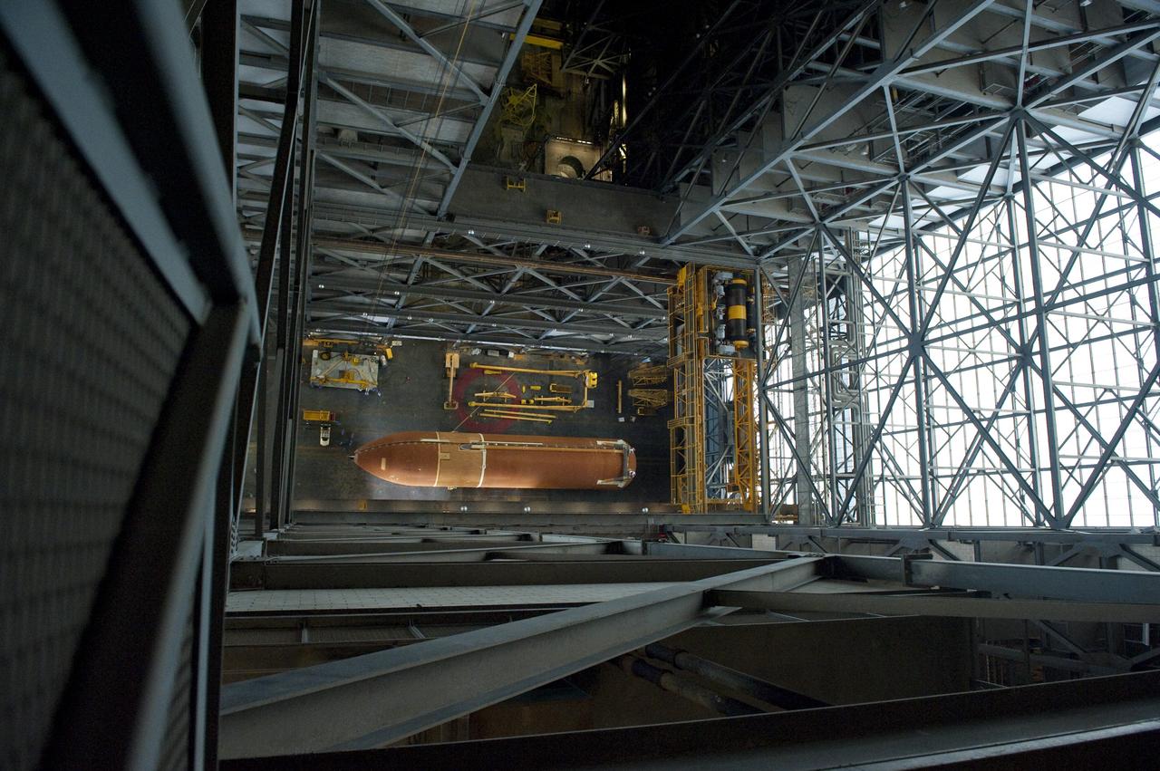CAPE CANAVERAL, Fla. -- At NASA's Kennedy Space Center in Florida, this overhead image shows the Space Shuttle Program's last external fuel tank, ET-122, after it was delivered to the transfer aisle of the Vehicle Assembly Building (VAB).          The tank traveled 900 miles by sea, carried in the Pegasus Barge, from NASA's Michoud Assembly Facility in New Orleans. Once inside the VAB, it eventually will be attached to space shuttle Endeavour for the STS-134 mission to the International Space Station targeted to launch Feb. 2011. STS-134 currently is scheduled to be the last mission in the shuttle program. The tank, which is the largest element of the space shuttle stack, was damaged during Hurricane Katrina in August 2005 and restored to flight configuration by Lockheed Martin Space Systems Company employees. Photo credit: NASA/Kevin O'Connell