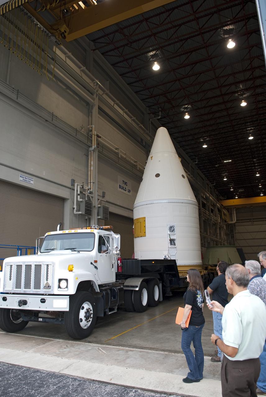 CAPE CANAVERAL, Fla. -- At NASA's Kennedy Space Center in Florida, the Space Shuttle Program's final solid rocket booster assembly -- the right-hand forward -- is on its transport, ready to be moved from Kennedy's Assembly Refurbishment Facility to the Vehicle Assembly Building (VAB).          The right and left forward assemblies, which are refurbished and processed at Kennedy, are comprised of three components -- nose cap, frustum and forward skirt. Inside the VAB, the boosters will be stacked, then joined to an external fuel tank and space shuttle Atlantis for what currently is planned as the "launch on need," or potential rescue mission, for Endeavour's STS-134 mission to the International Space Station targeted to launch in February, 2011. Photo credit: NASA/Jim Grossmann