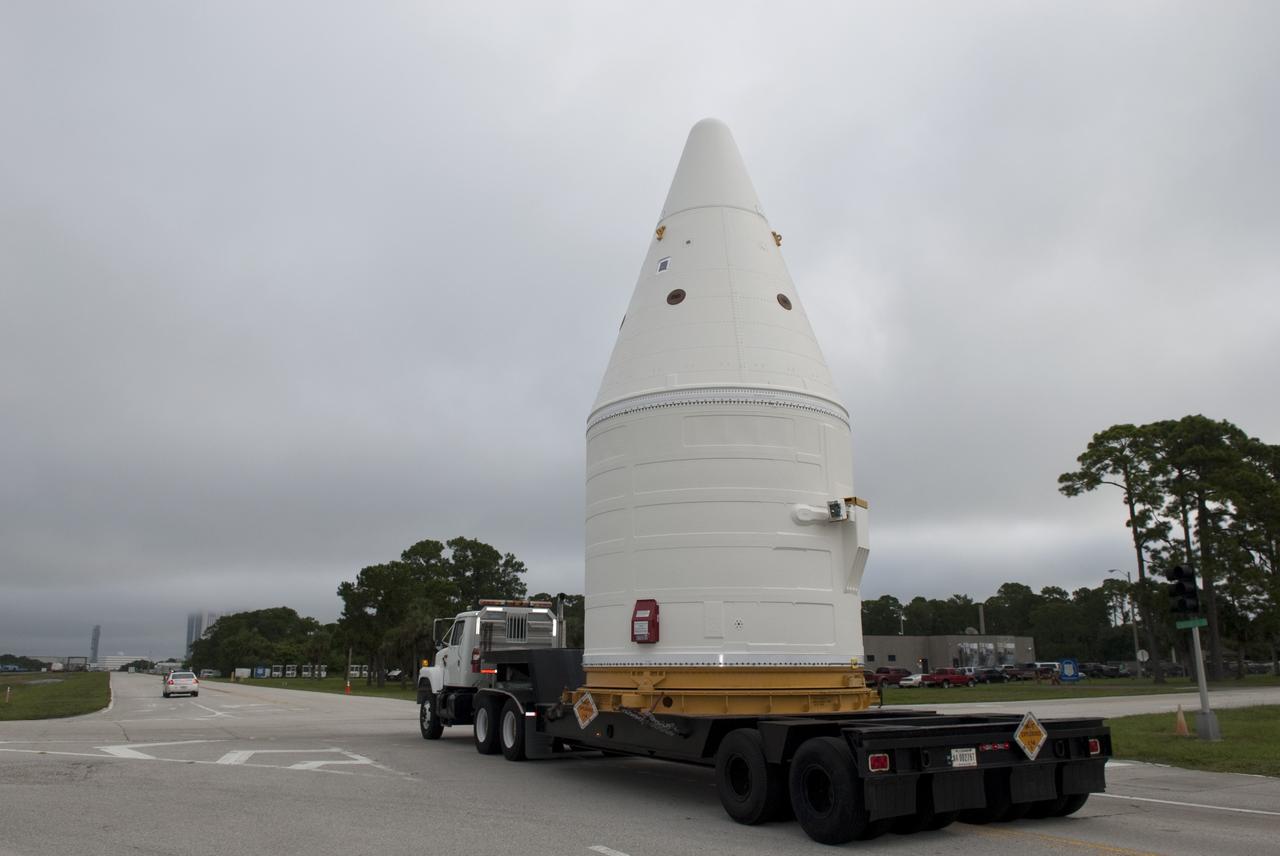 CAPE CANAVERAL, Fla. -- At NASA's Kennedy Space Center in Florida, the Space Shuttle Program's final solid rocket booster assembly -- the right-hand forward -- is being transported from Kennedy's Assembly Refurbishment Facility to the Vehicle Assembly Building (VAB).          The right and left forward assemblies, which are refurbished and processed at Kennedy, are comprised of three components -- nose cap, frustum and forward skirt. Inside the VAB, the boosters will be stacked, then joined to an external fuel tank and space shuttle Atlantis for what currently is planned as the "launch on need," or potential rescue mission, for Endeavour's STS-134 mission to the International Space Station targeted to launch in February, 2011. Photo credit: NASA/Jim Grossmann
