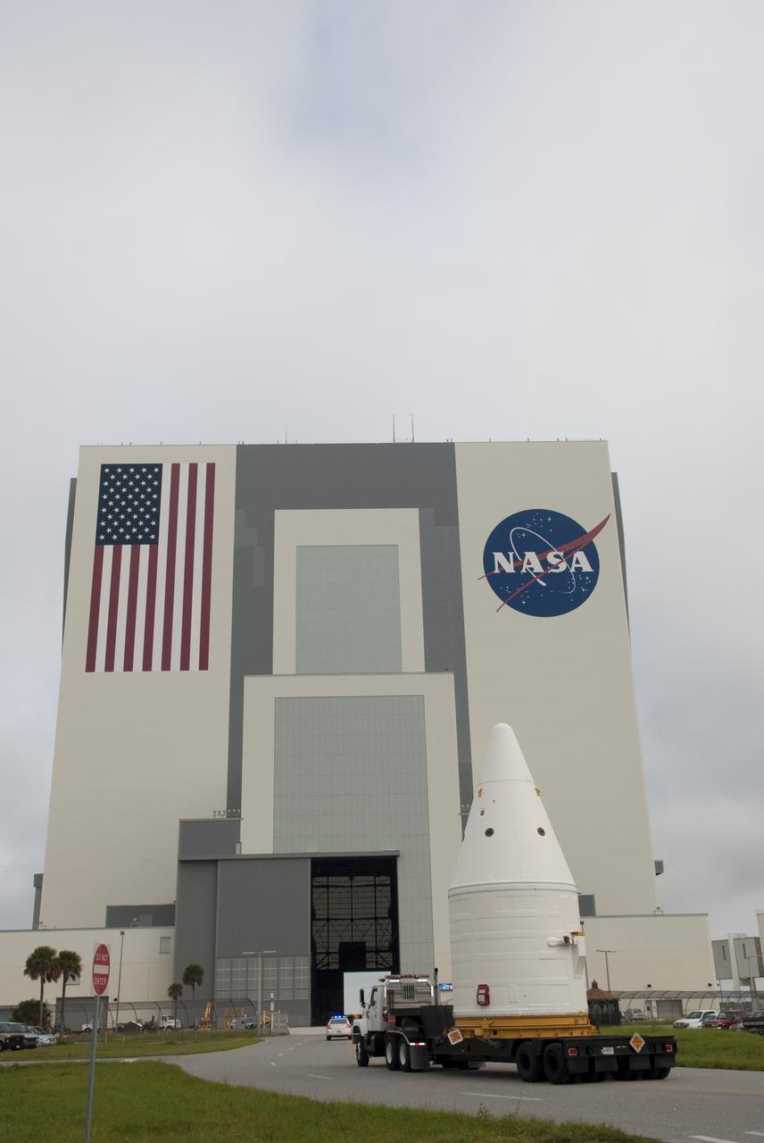 CAPE CANAVERAL, Fla. -- At NASA's Kennedy Space Center in Florida, the Space Shuttle Program's final solid rocket booster assembly -- the right-hand forward -- is being moved to the Vehicle Assembly Building (VAB) from Kennedy's Assembly Refurbishment Facility.          The right and left forward assemblies, which are refurbished and processed at Kennedy, are comprised of three components -- nose cap, frustum and forward skirt. Inside the VAB, the boosters will be stacked, then joined to an external fuel tank and space shuttle Atlantis for what currently is planned as the "launch on need," or potential rescue mission, for Endeavour's STS-134 mission to the International Space Station targeted to launch in February, 2011. Photo credit: NASA/Jim Grossmann
