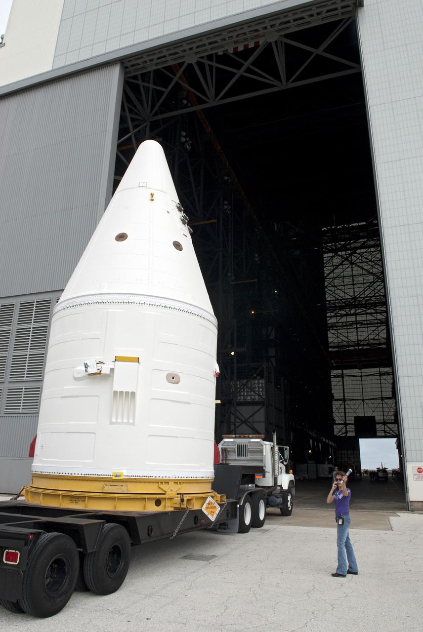 CAPE CANAVERAL, Fla. -- At NASA's Kennedy Space Center in Florida, the Space Shuttle Program's final solid rocket booster assembly -- the right-hand forward -- is being delivered to the Vehicle Assembly Building (VAB) from Kennedy's Assembly Refurbishment Facility.          The right and left forward assemblies, which are refurbished and processed at Kennedy, are comprised of three components -- nose cap, frustum and forward skirt. Inside the VAB, the boosters will be stacked, then joined to an external fuel tank and space shuttle Atlantis for what currently is planned as the "launch on need," or potential rescue mission, for Endeavour's STS-134 mission to the International Space Station targeted to launch in February, 2011. Photo credit: NASA/Jim Grossmann
