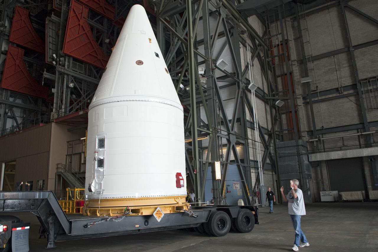 CAPE CANAVERAL, Fla. -- At NASA's Kennedy Space Center in Florida, the Space Shuttle Program's final solid rocket booster assembly -- the right-hand forward -- is being delivered to the transfer aisle of the Vehicle Assembly Building (VAB).          The right and left forward assemblies, which are refurbished and processed at Kennedy, are comprised of three components -- nose cap, frustum and forward skirt. Inside the VAB, the boosters will be stacked, then joined to an external fuel tank and space shuttle Atlantis for what currently is planned as the "launch on need," or potential rescue mission, for Endeavour's STS-134 mission to the International Space Station targeted to launch in February, 2011. Photo credit: NASA/Jim Grossmann
