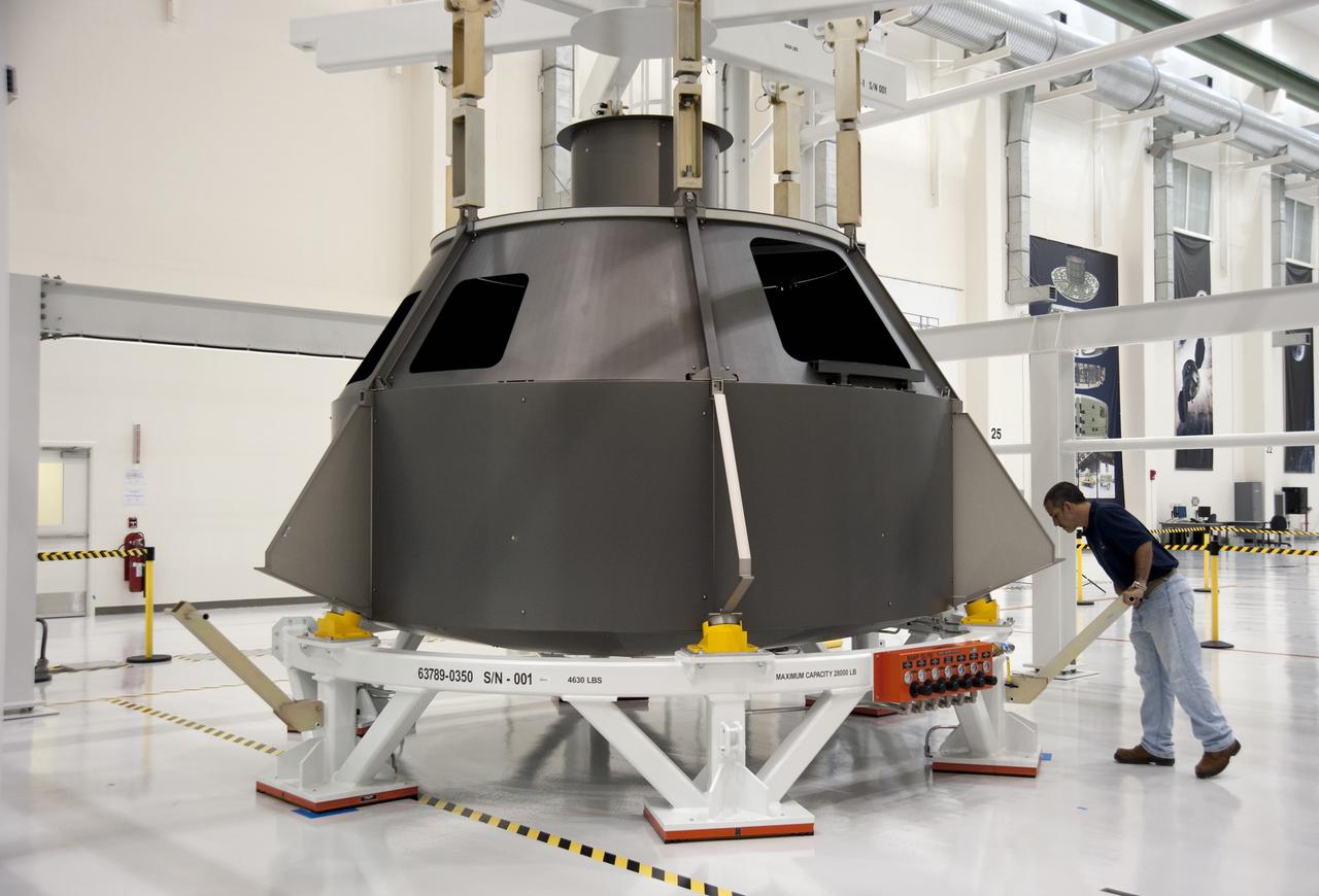 CAPE CANAVERAL, Fla. -- In the Operations and Checkout Building at NASA's Kennedy Space Center in Florida, a Lockheed Martin-led crew begins pathfinding operations on a full-scale Orion spacecraft mockup. The crew is conducting simulated manufacturing and assembly operations with the mockup to verify the tools, processes and spacecraft integration procedures work as expected. For more information visit www.nasa.gov/orion. Photo credit: NASA/Kim Shiflett, Troy Cryder