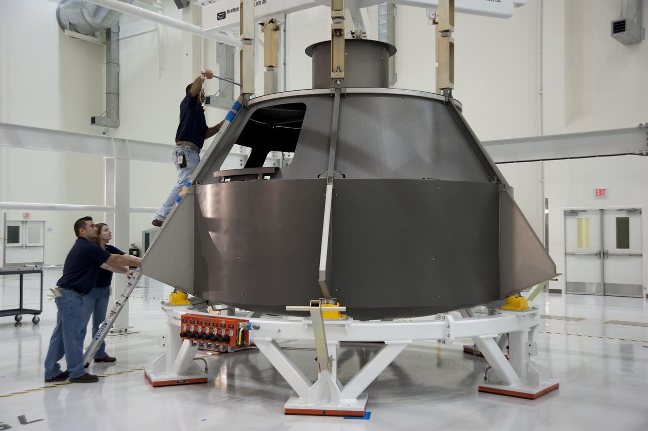 CAPE CANAVERAL, Fla. -- In the Operations and Checkout Building at NASA's Kennedy Space Center in Florida, a Lockheed Martin-led crew begins pathfinding operations on a full-scale Orion spacecraft mockup. The crew is conducting simulated manufacturing and assembly operations with the mockup to verify the tools, processes and spacecraft integration procedures work as expected. For more information visit www.nasa.gov/orion. Photo credit: NASA/Kim Shiflett, Troy Cryder