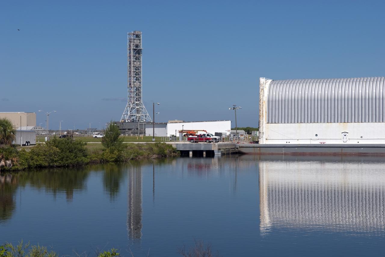 CAPE CANAVERAL, Fla. -- At NASA's Kennedy Space Center in Florida, a crawler-transporter moves NASA's new mobile launcher (ML) support structure from a construction site, north of the Vehicle Assembly Building, to the Mobile Launcher east park site. The base of the launcher is lighter than space shuttle mobile launcher platforms so the crawler-transporter can pick up the heavier load of the tower and a taller rocket. Once there, the ML can be outfitted with ground support equipment, such as umbilicals and access arms, for future rocket launches. It took about two years to construct the 355-foot-tall structure, which will support NASA's future human spaceflight program. Photo credit: NASA/Jim Grossmann